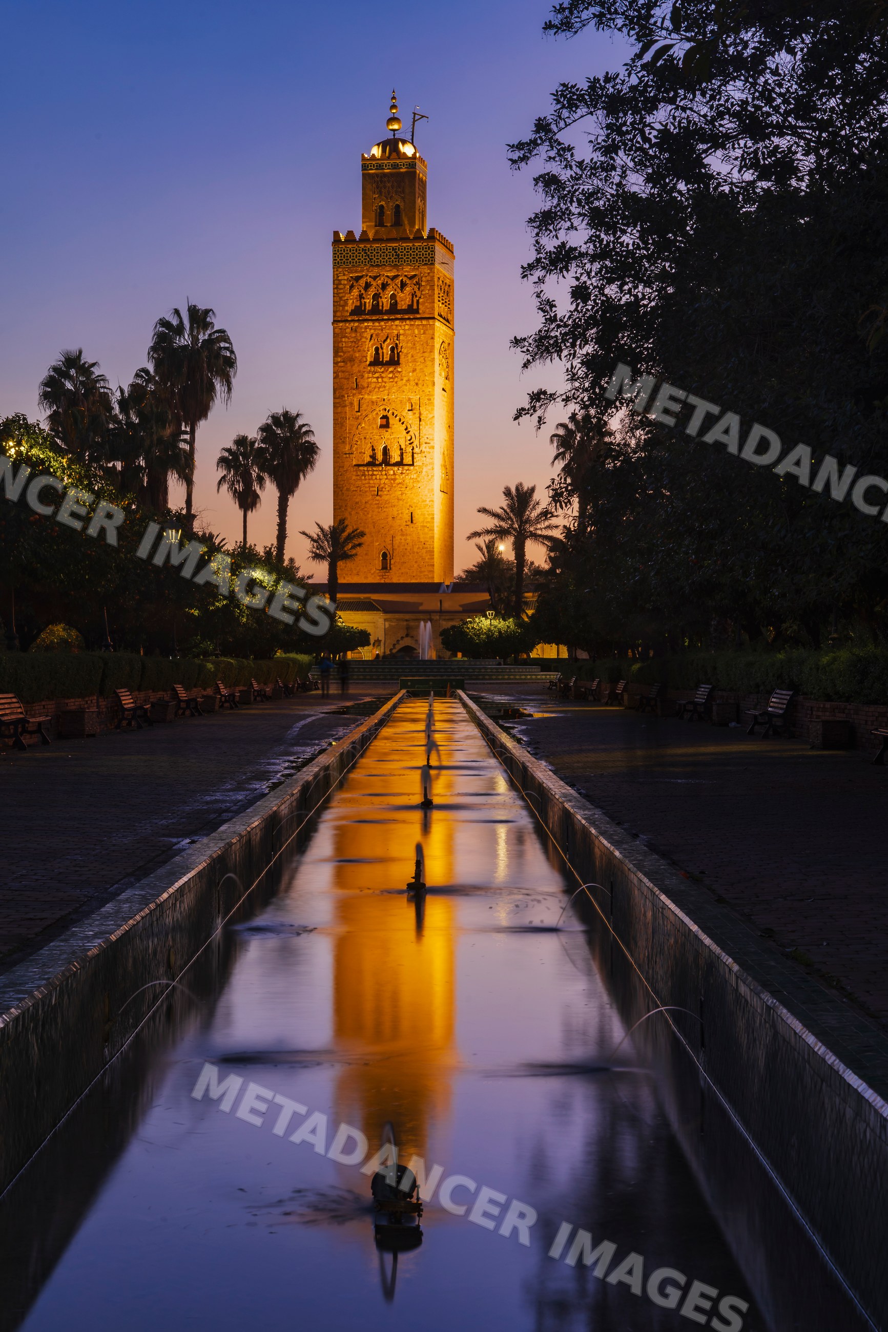 Koutoubia minaret reflected in a fountain at Dawn in marrakech Morocco