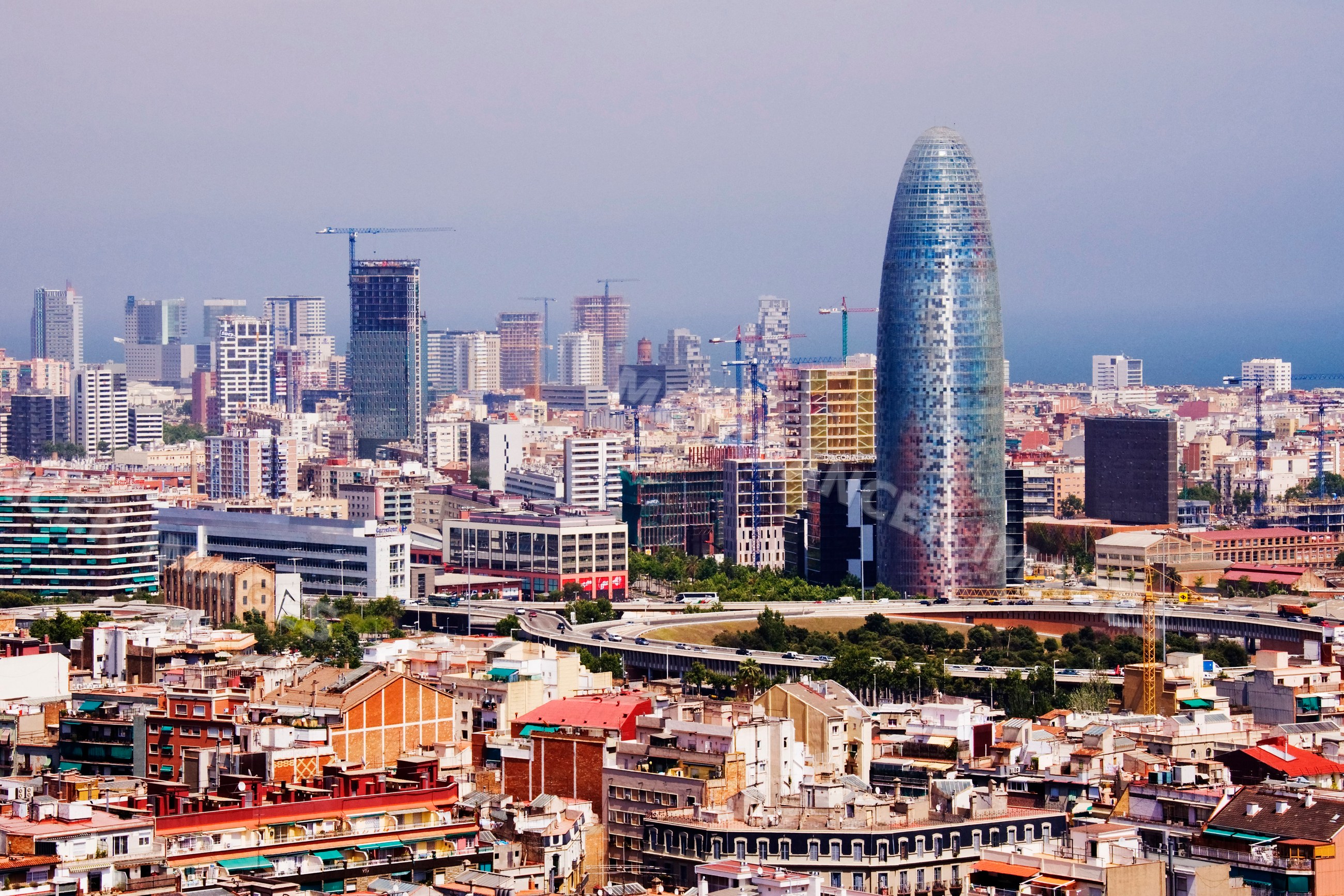 Barcelona cityscape featuring torre glòries and urban skyline