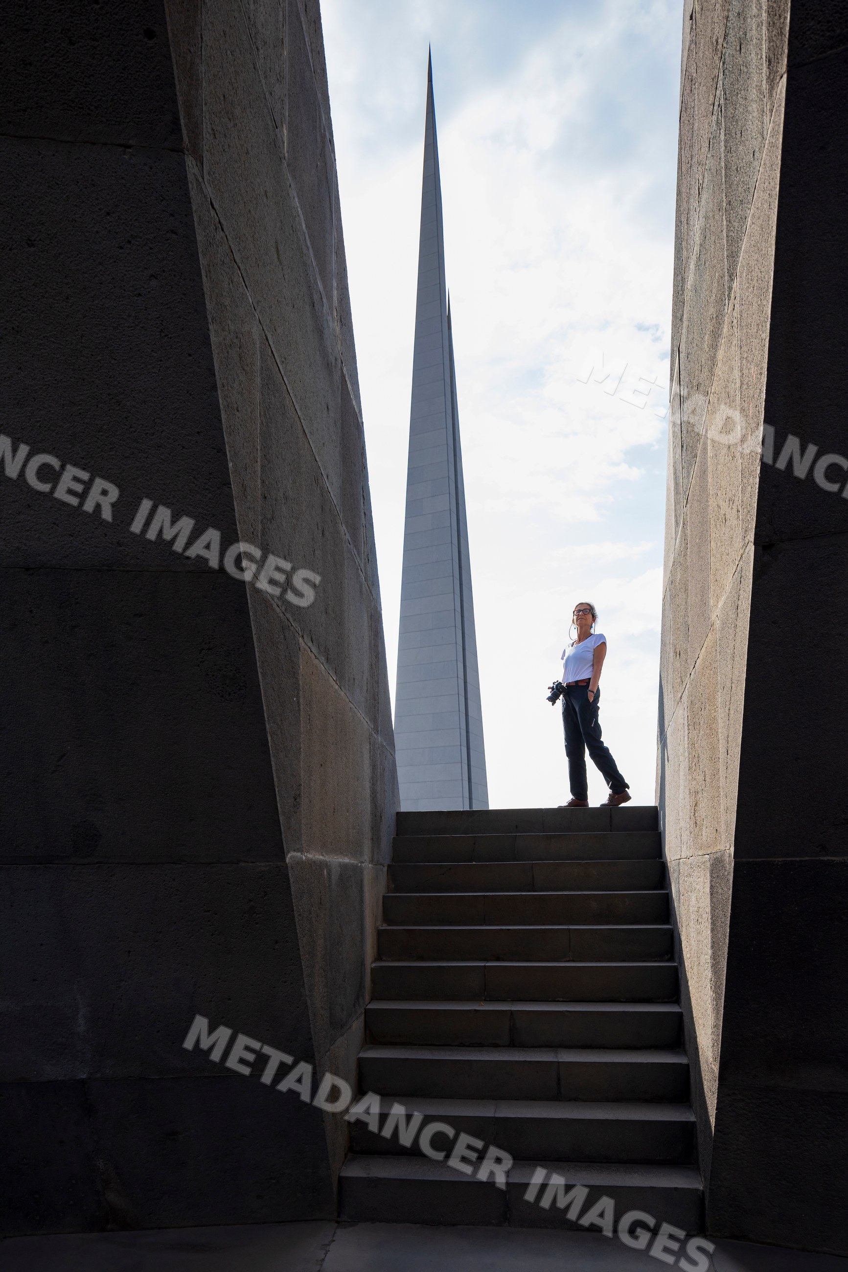 Armenian Genocide Memorial spire and visitor