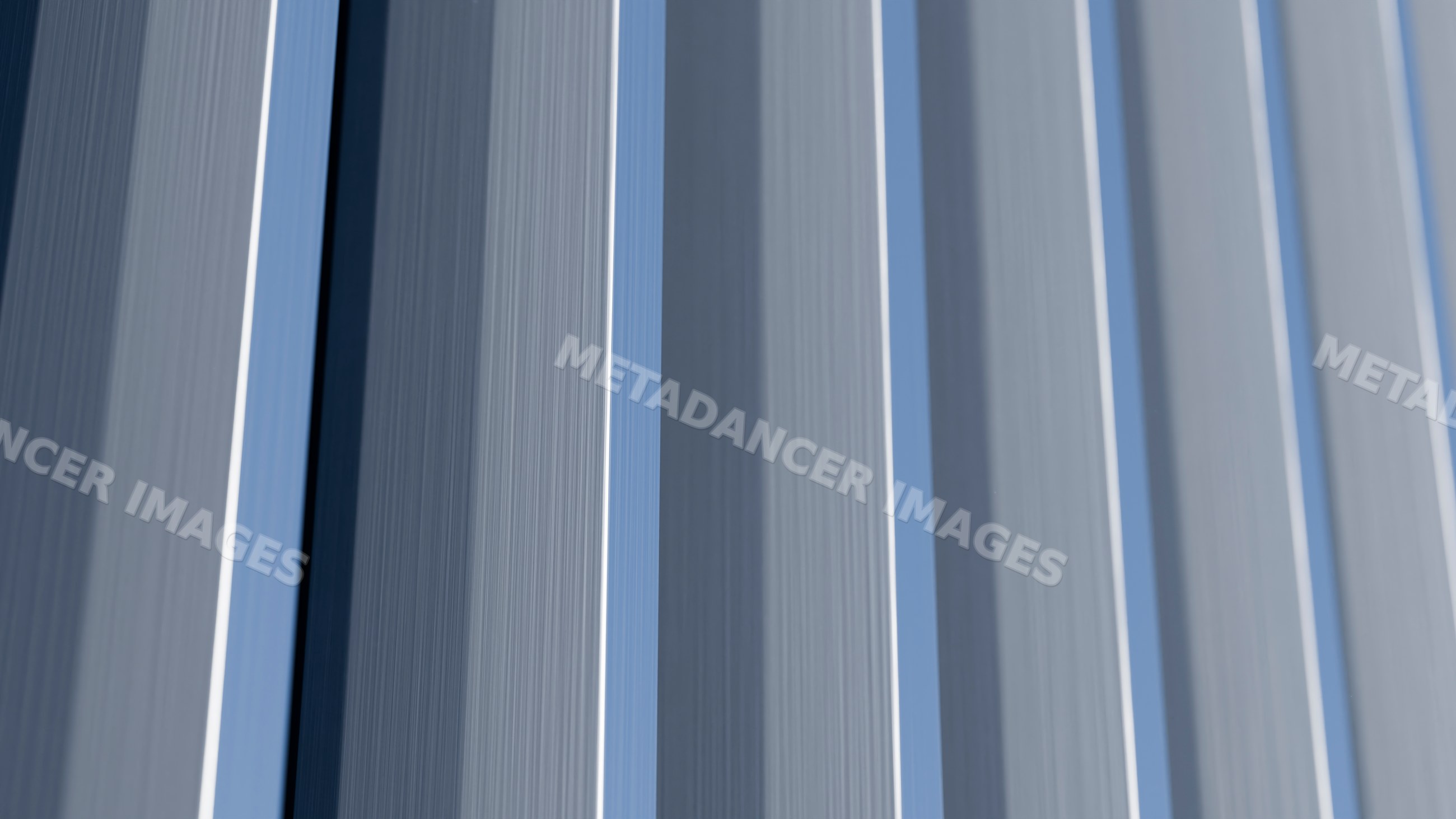 Close-up of vertical blue, gray, and white fabric stripes with texture