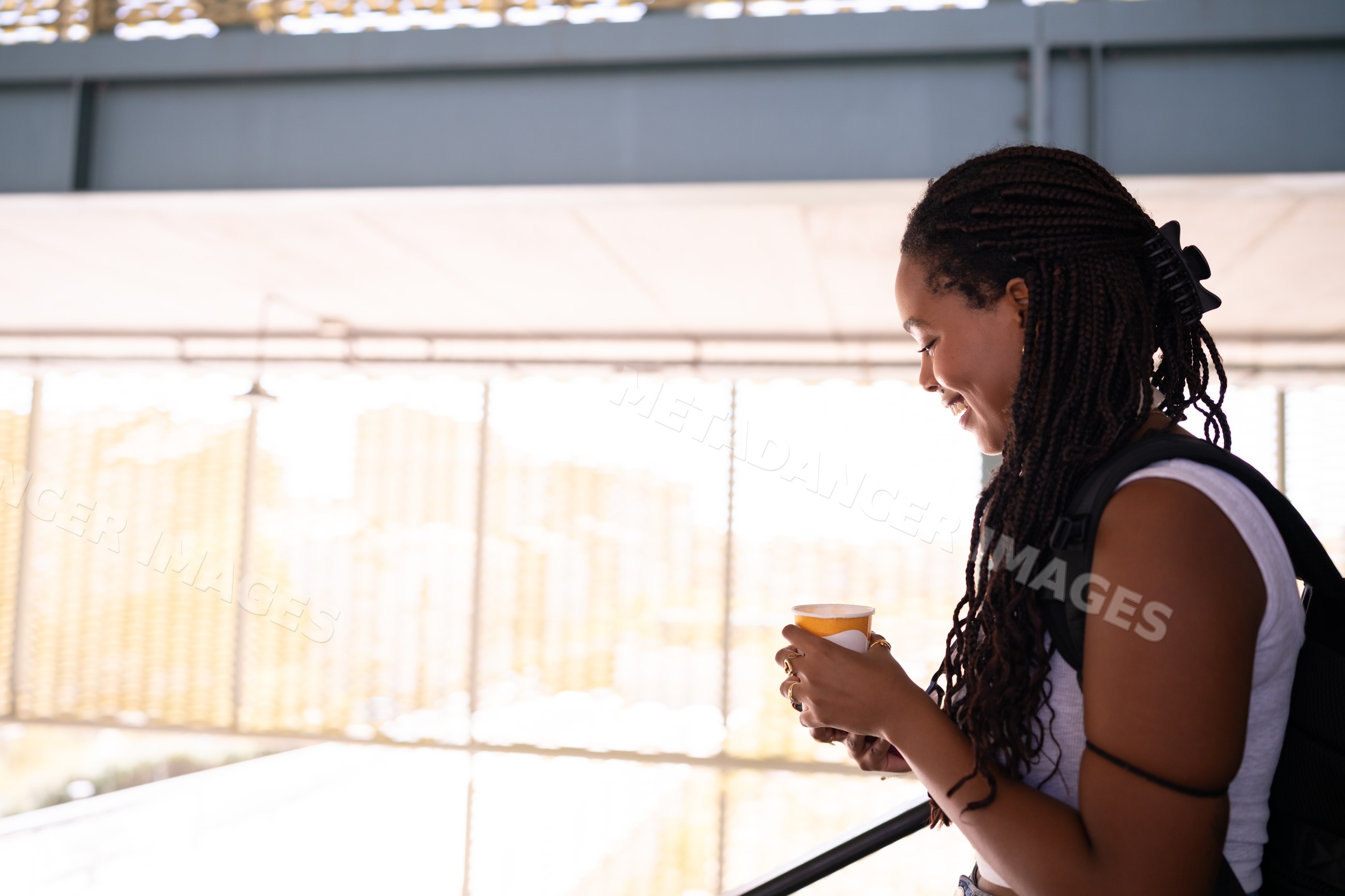 A African American woman enjoys a warm cup of coffee