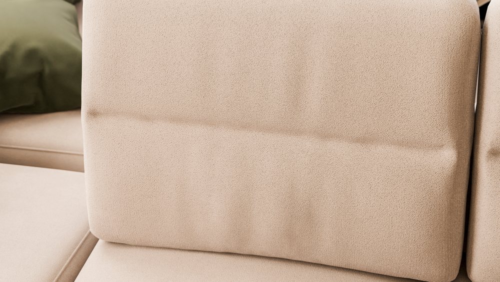 Beige sofa cushion with green pillow in living room