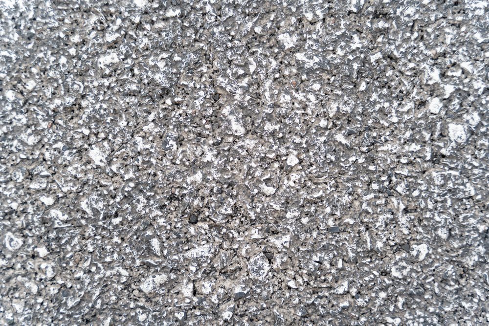 Detailed rough gray concrete surface texture close-up