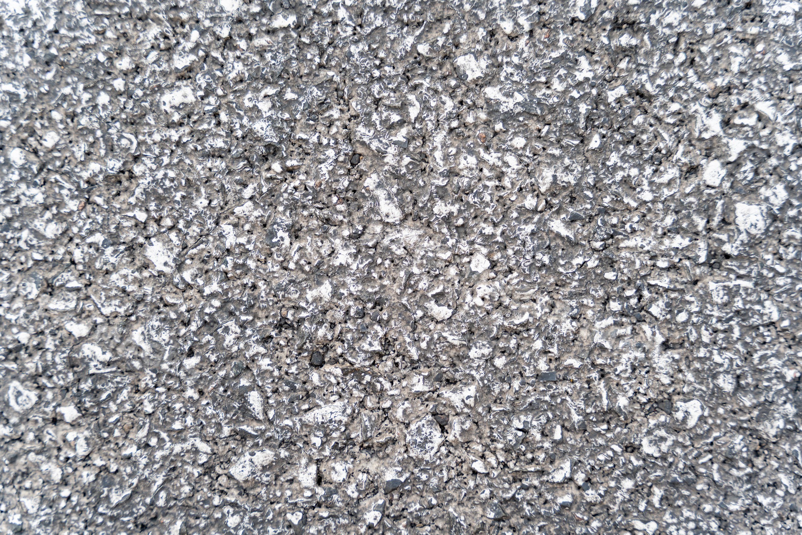 Detailed rough gray concrete surface texture close-up