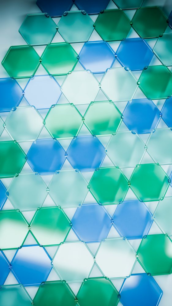 Colored transparent glass hexagons arranged in geometric pattern