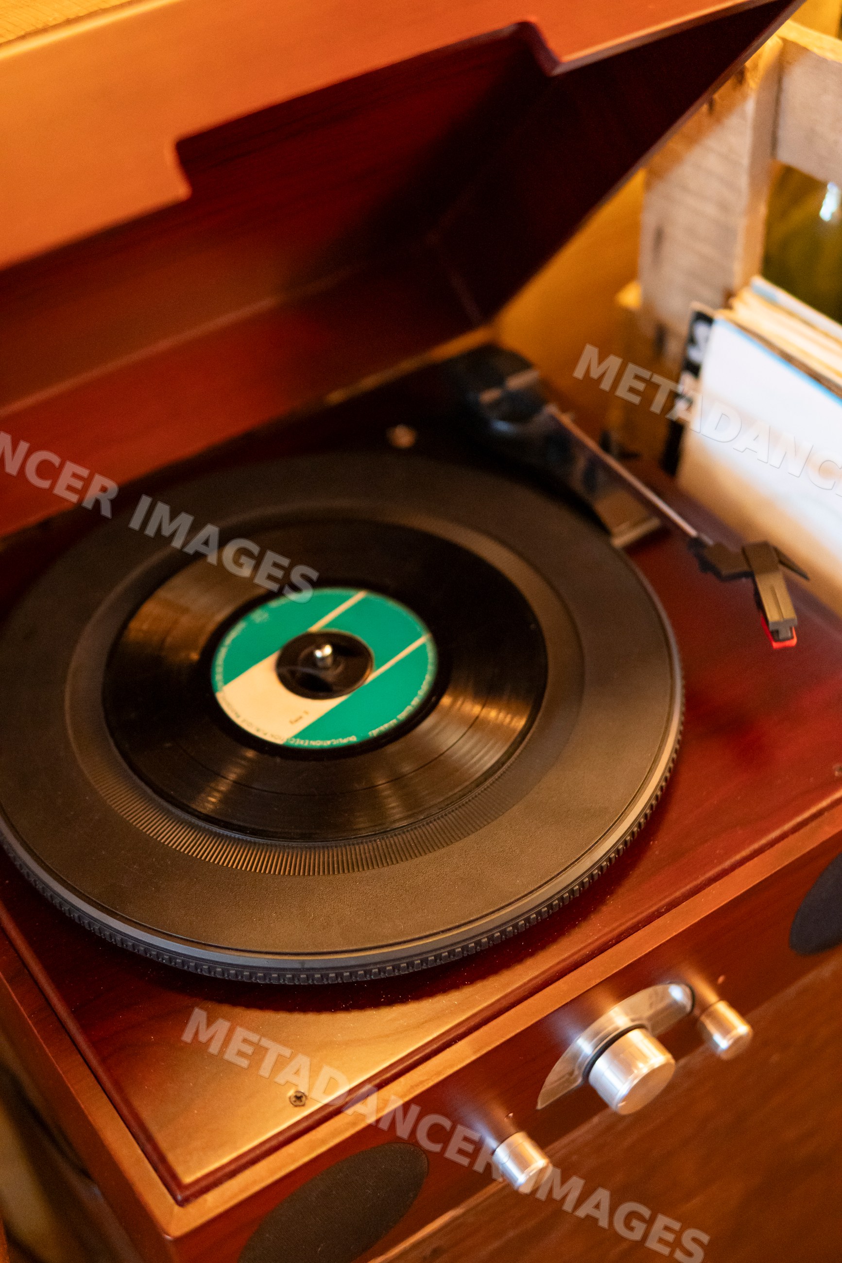 Vinyl record playing on a vintage wooden turntable in Verdun France