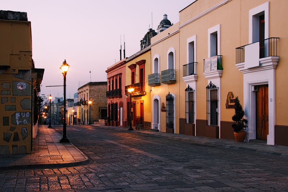 Historic street with lamp posts and colonial buildings mexico