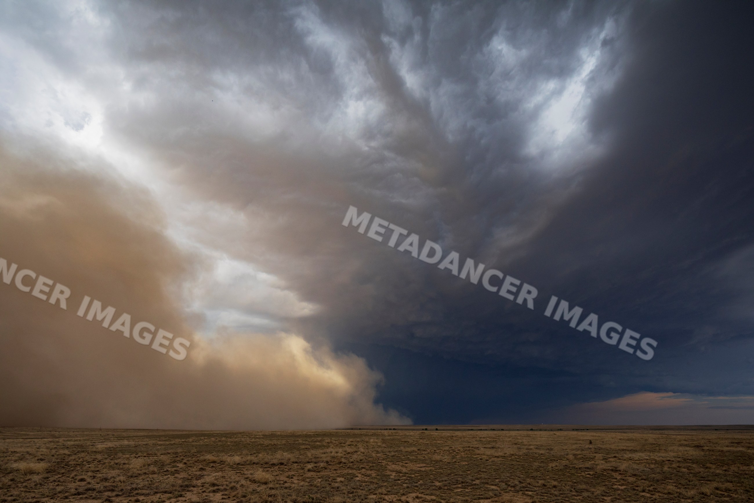Dust Storm advancing over dry field near fowler, colorado
