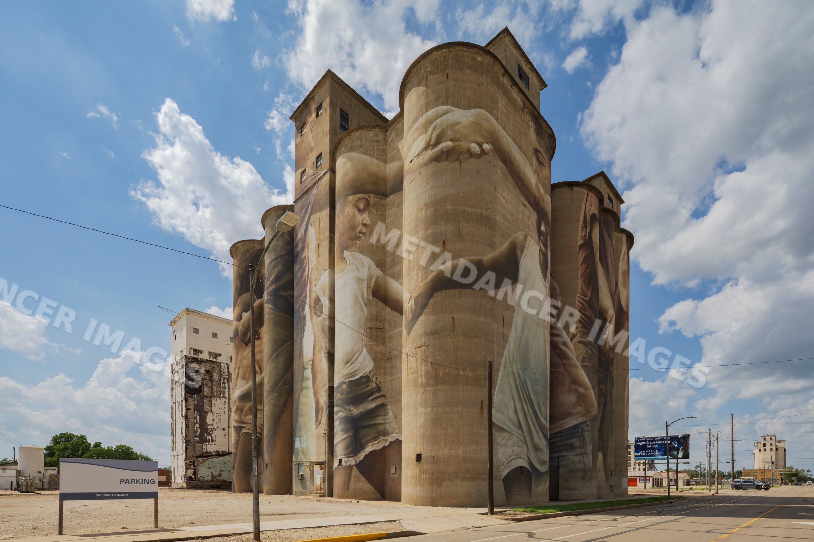 Grain Silo mural of children holding hands in salina, kansas