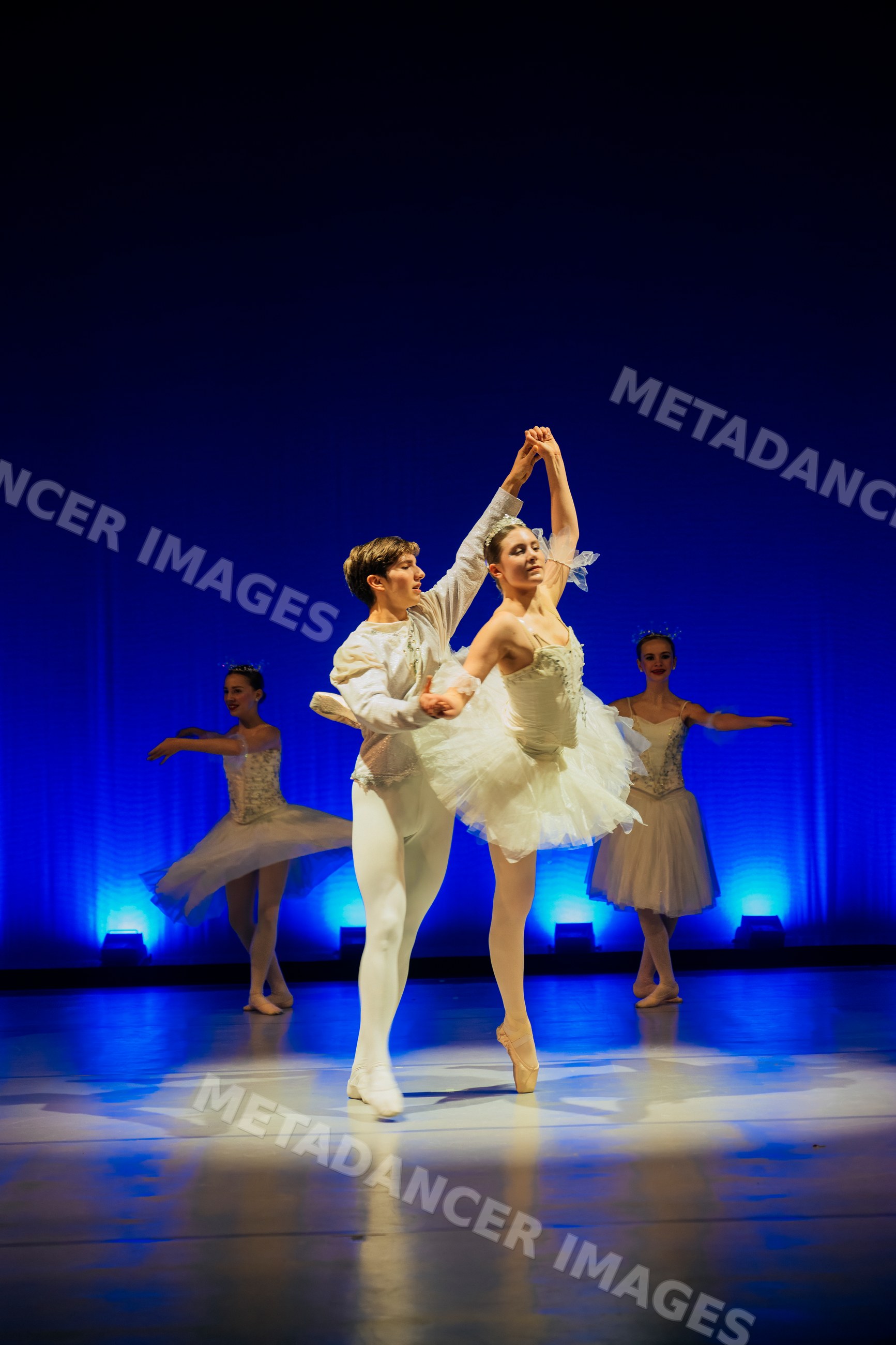 Ballet dancers perform a holiday-themed ballet dance on stage