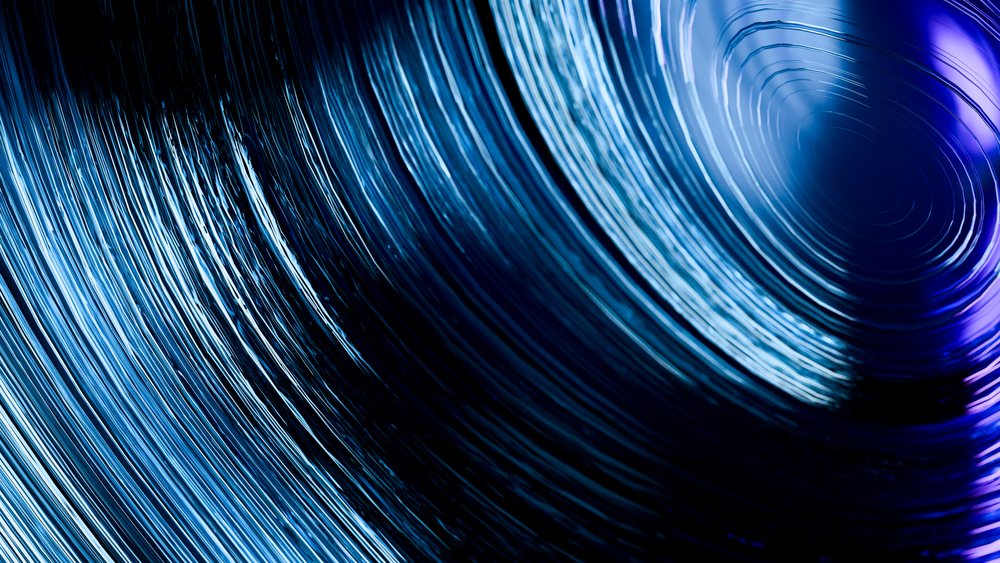 Close-up of blue rolled steel coils showing metal texture