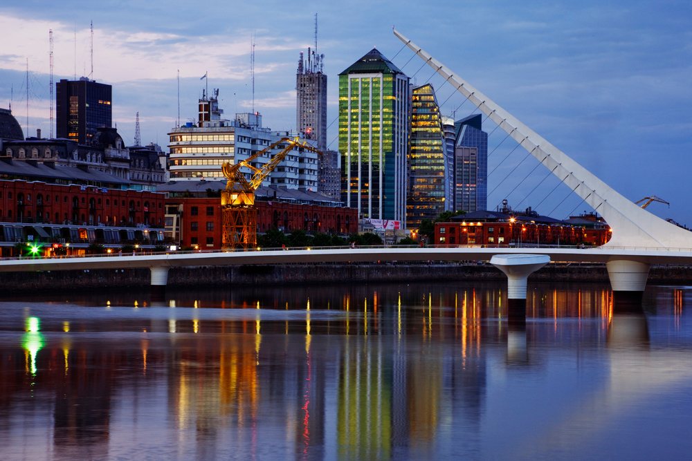 Puente de la mujer bridge crossing river at dusk, argentina