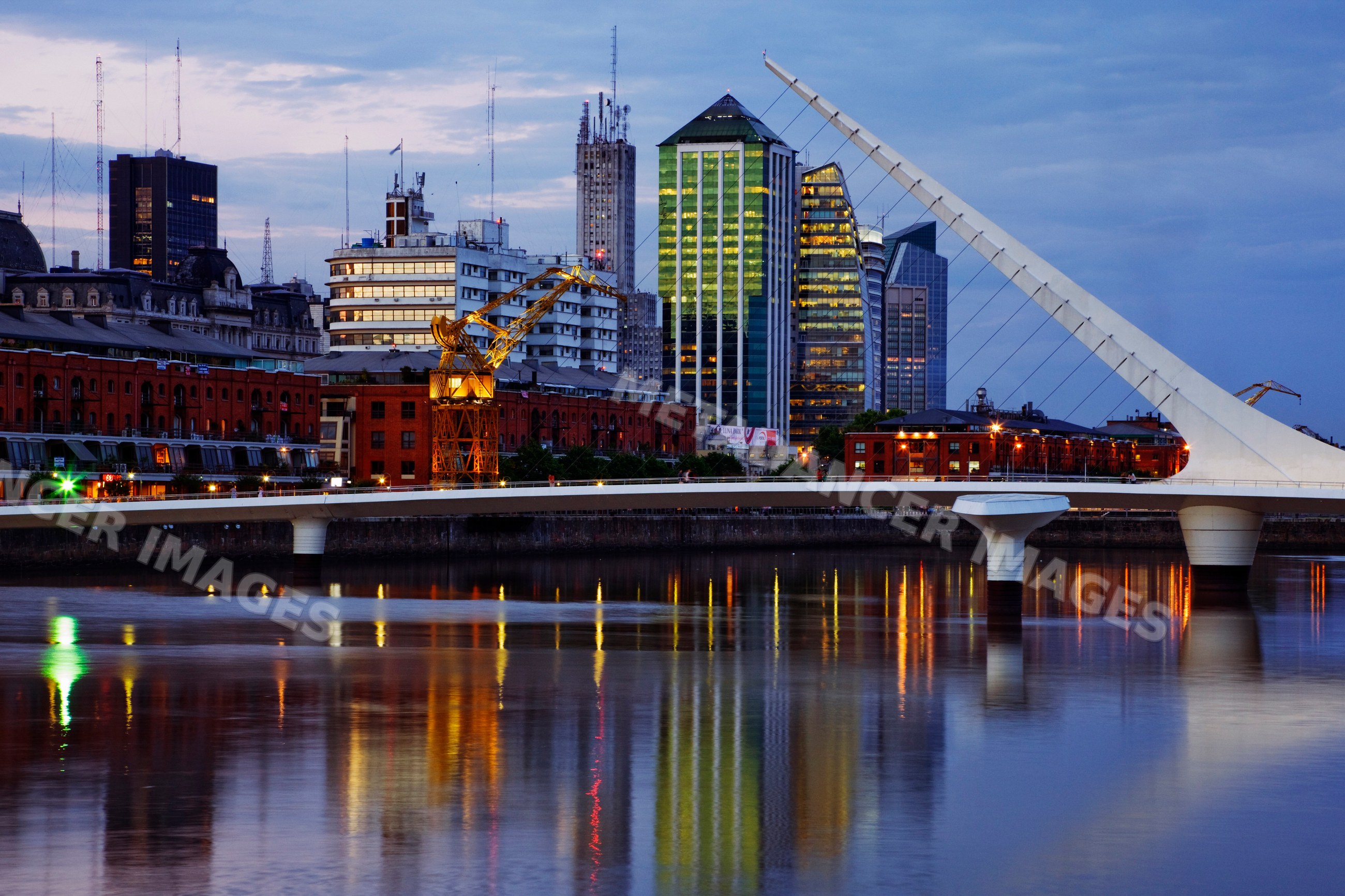 Puente de la mujer bridge crossing river at dusk, argentina