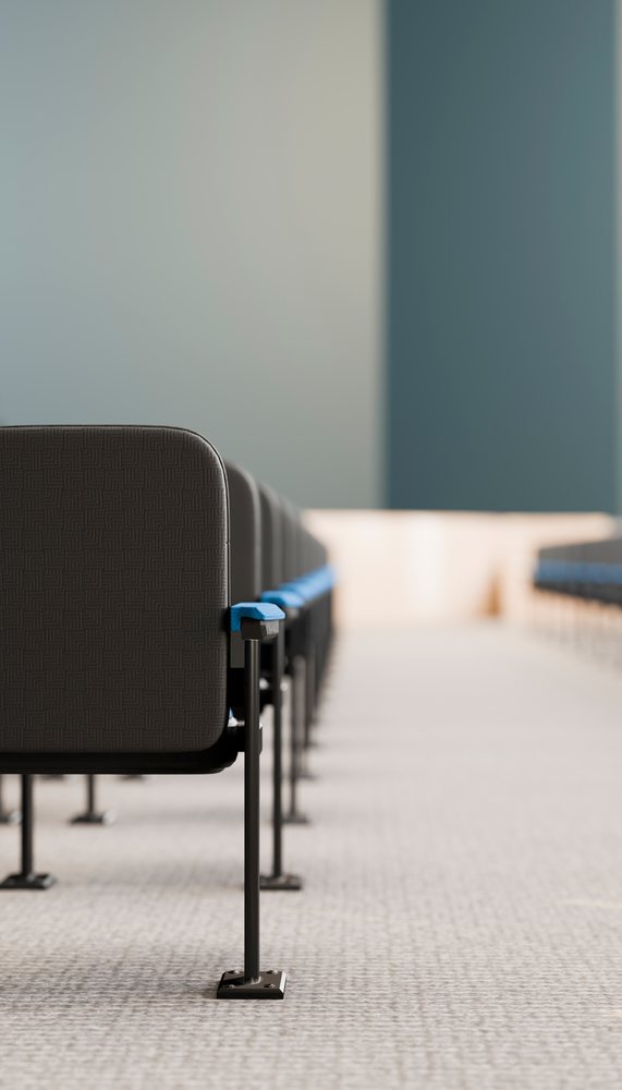 Conference chairs in neat rows inside a modern meeting space