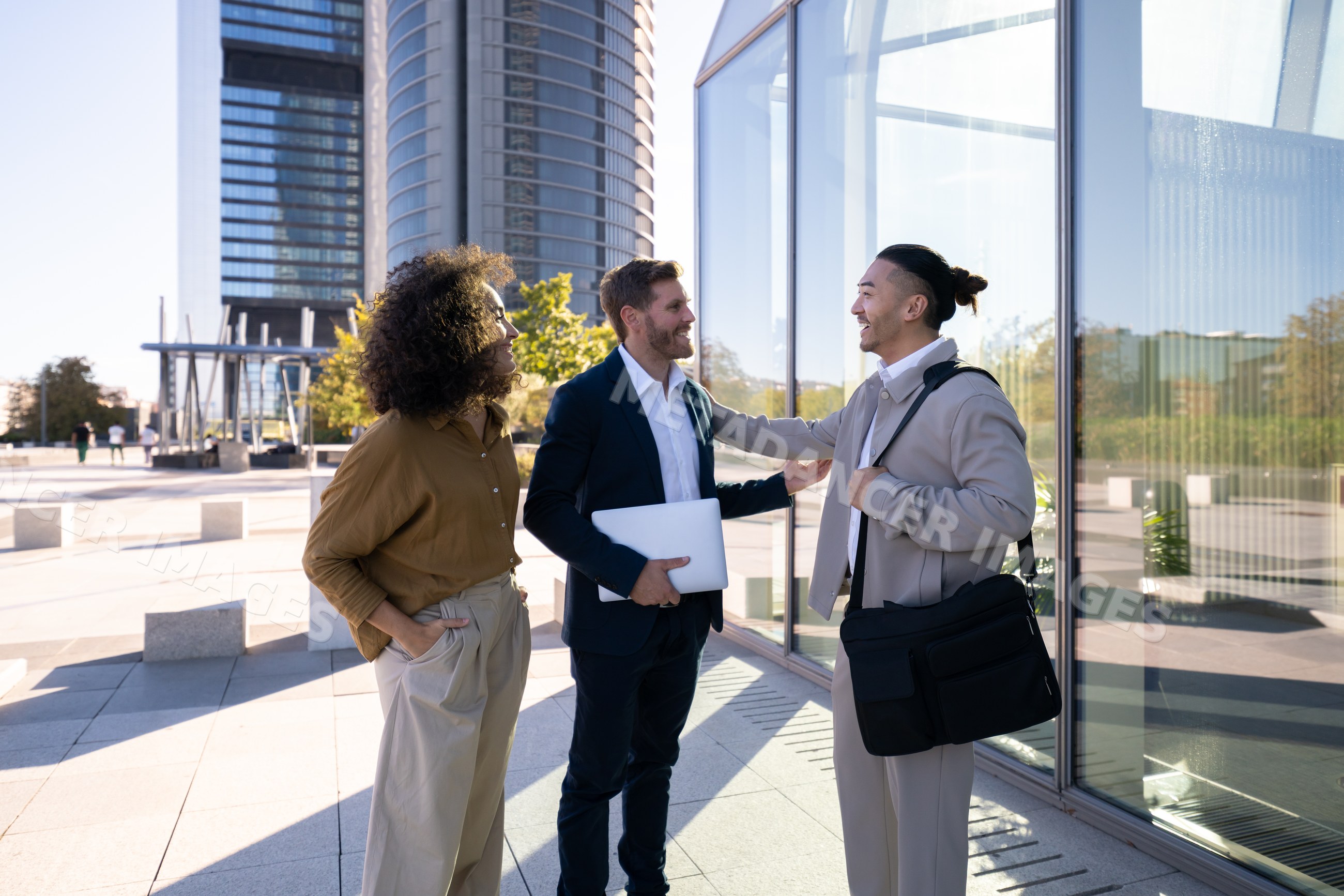 Business white professionals discussing outside modern office building