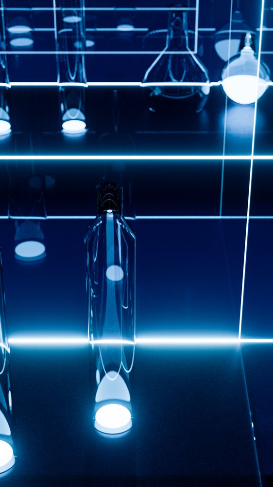 Glass bottle reflecting blue neon lights in dark studio environment