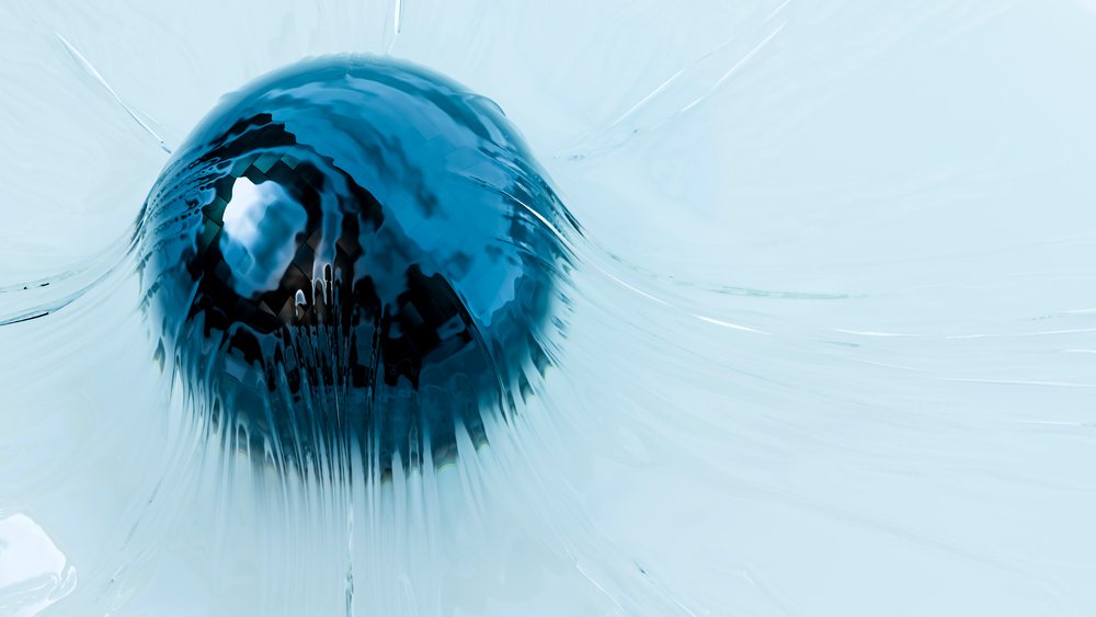 Blueberry splashing into water with droplets and ripples
