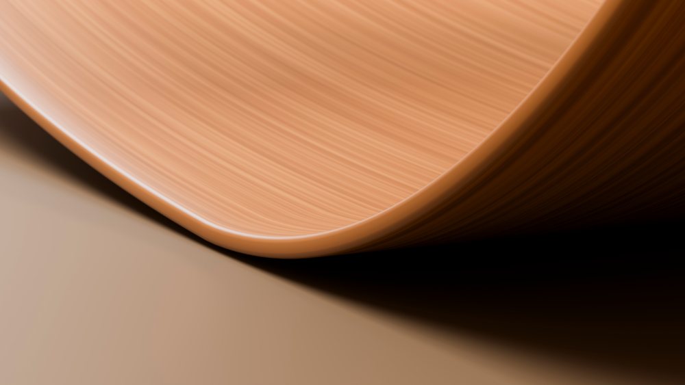 Close-up of smooth curved wood surface with natural texture