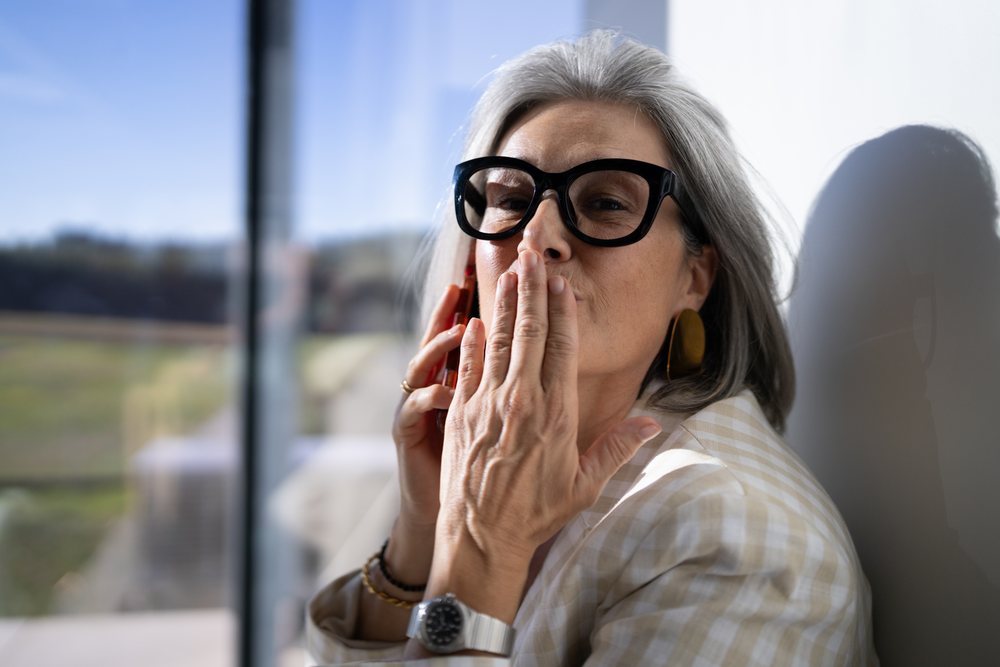 White woman blowing a kiss