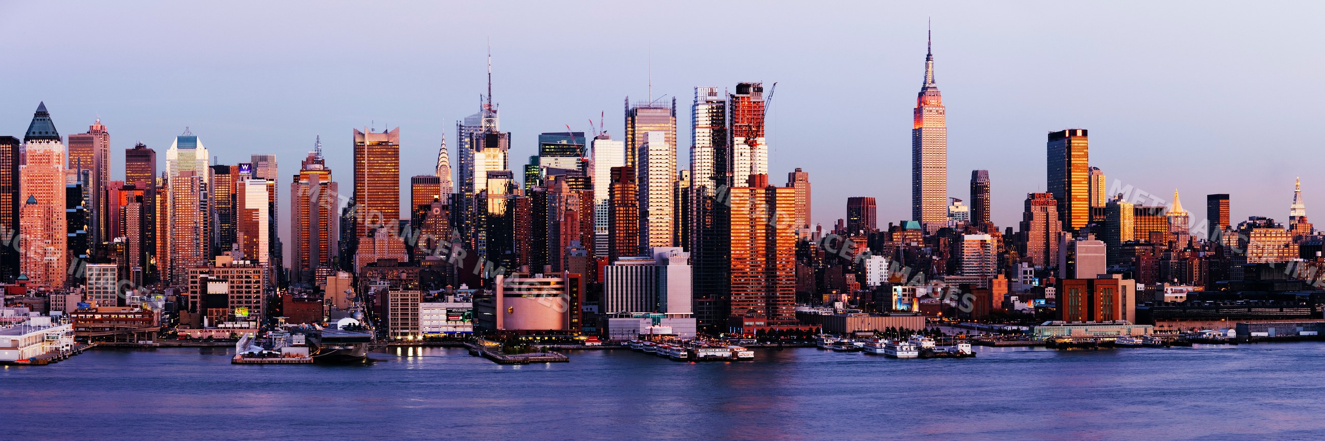 New york city skyline with empire state building at sunset