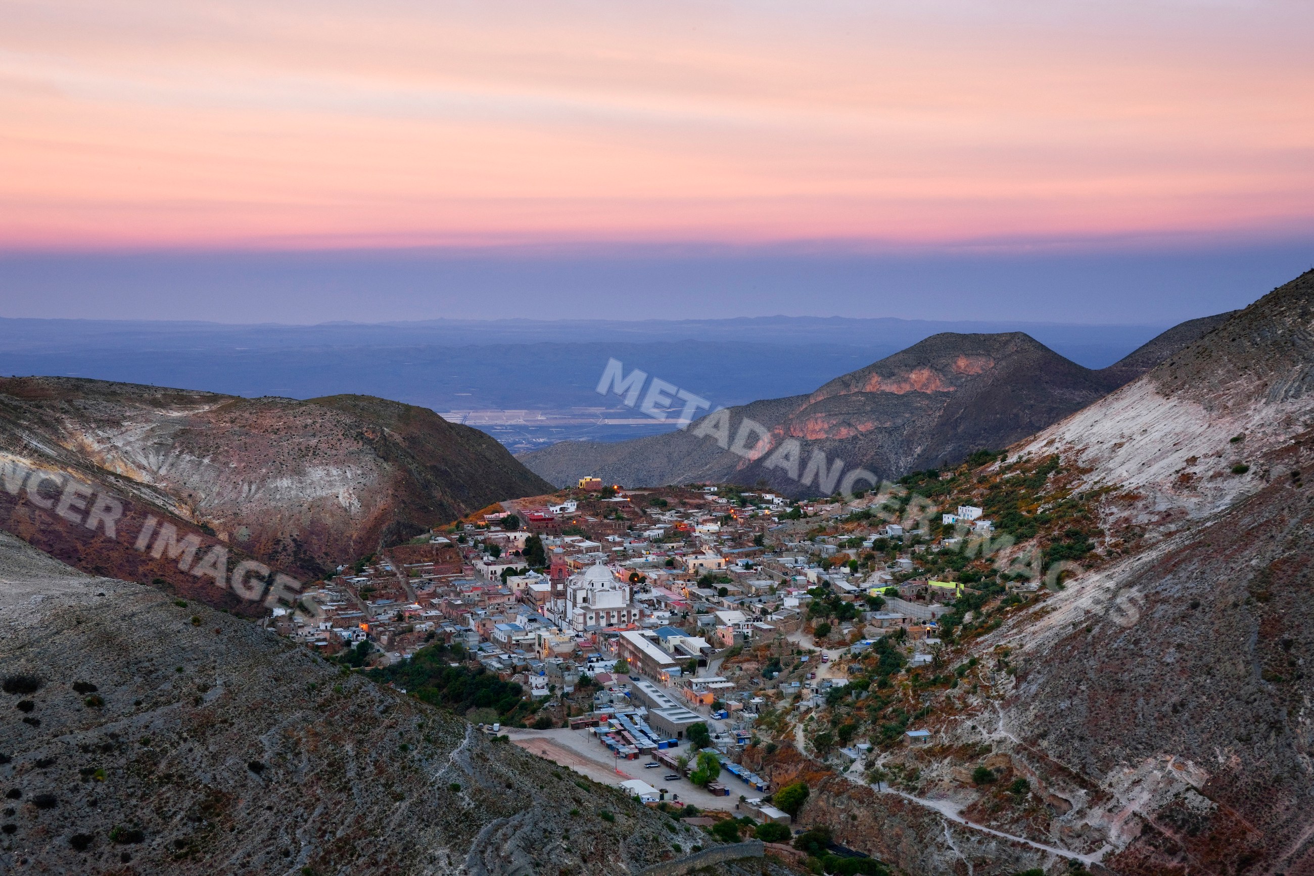 Real de catorce town nestled in mountains at sunset mexico