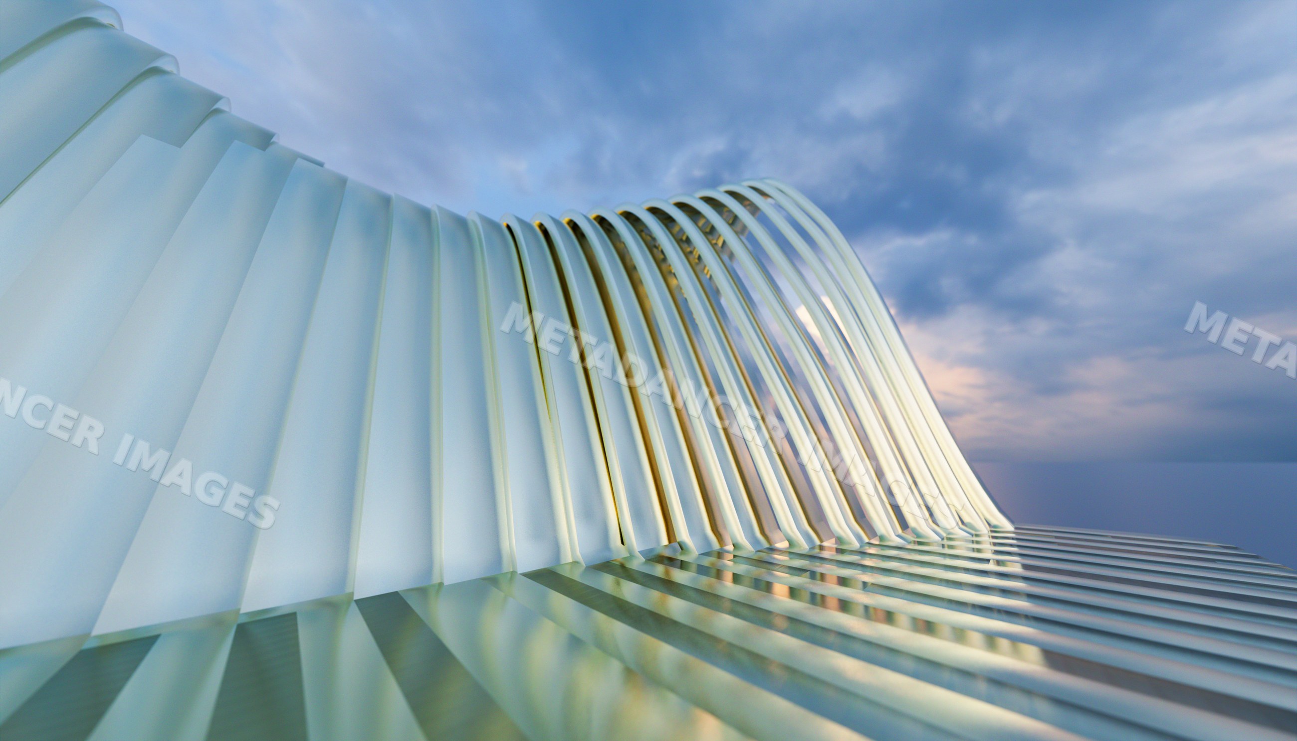 Curved metal architectural structure reflecting sunset light