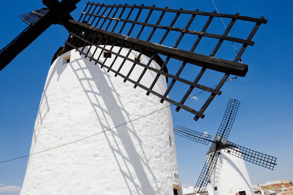 White historic windmills under clear sky, la mancha