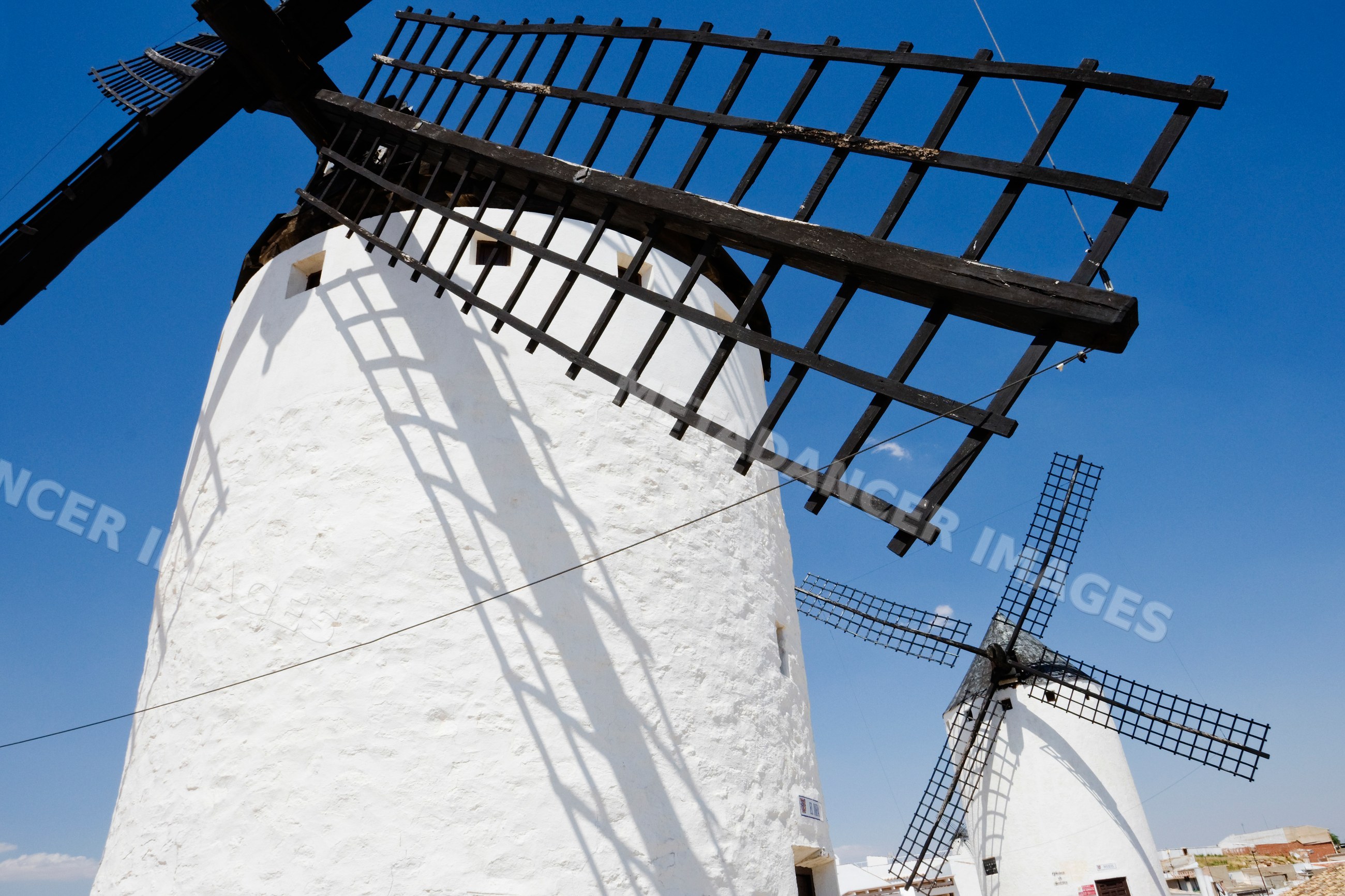 White historic windmills under clear sky, la mancha