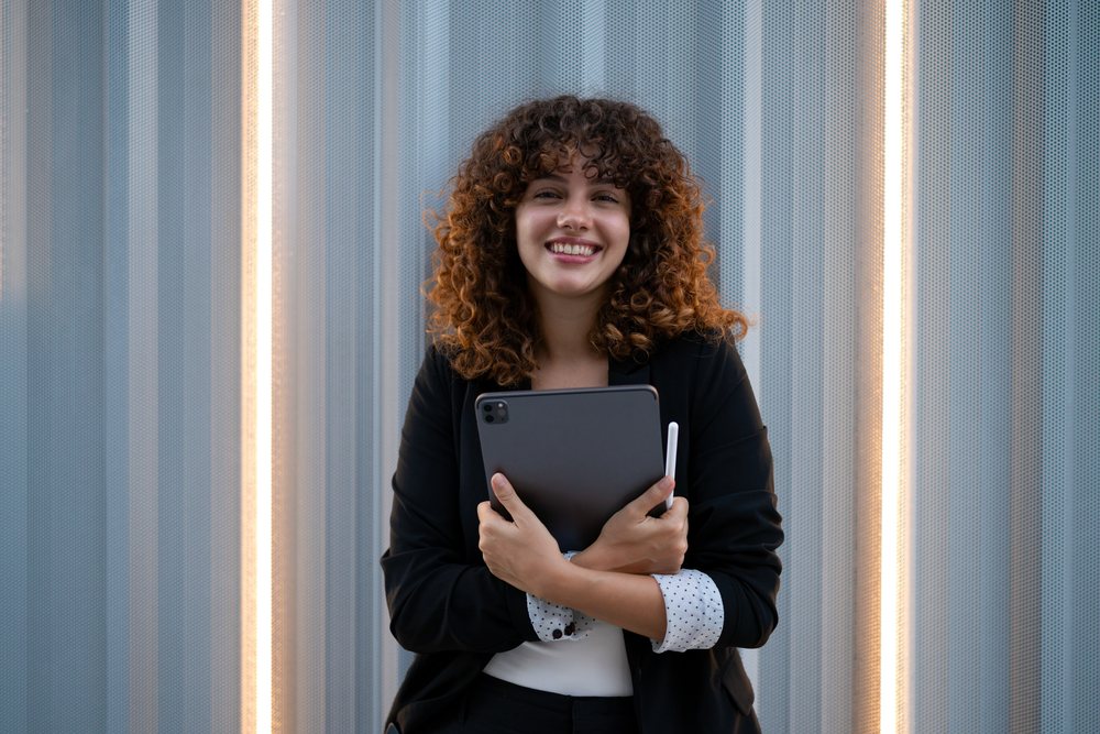 Young businesswoman holding digital tablet