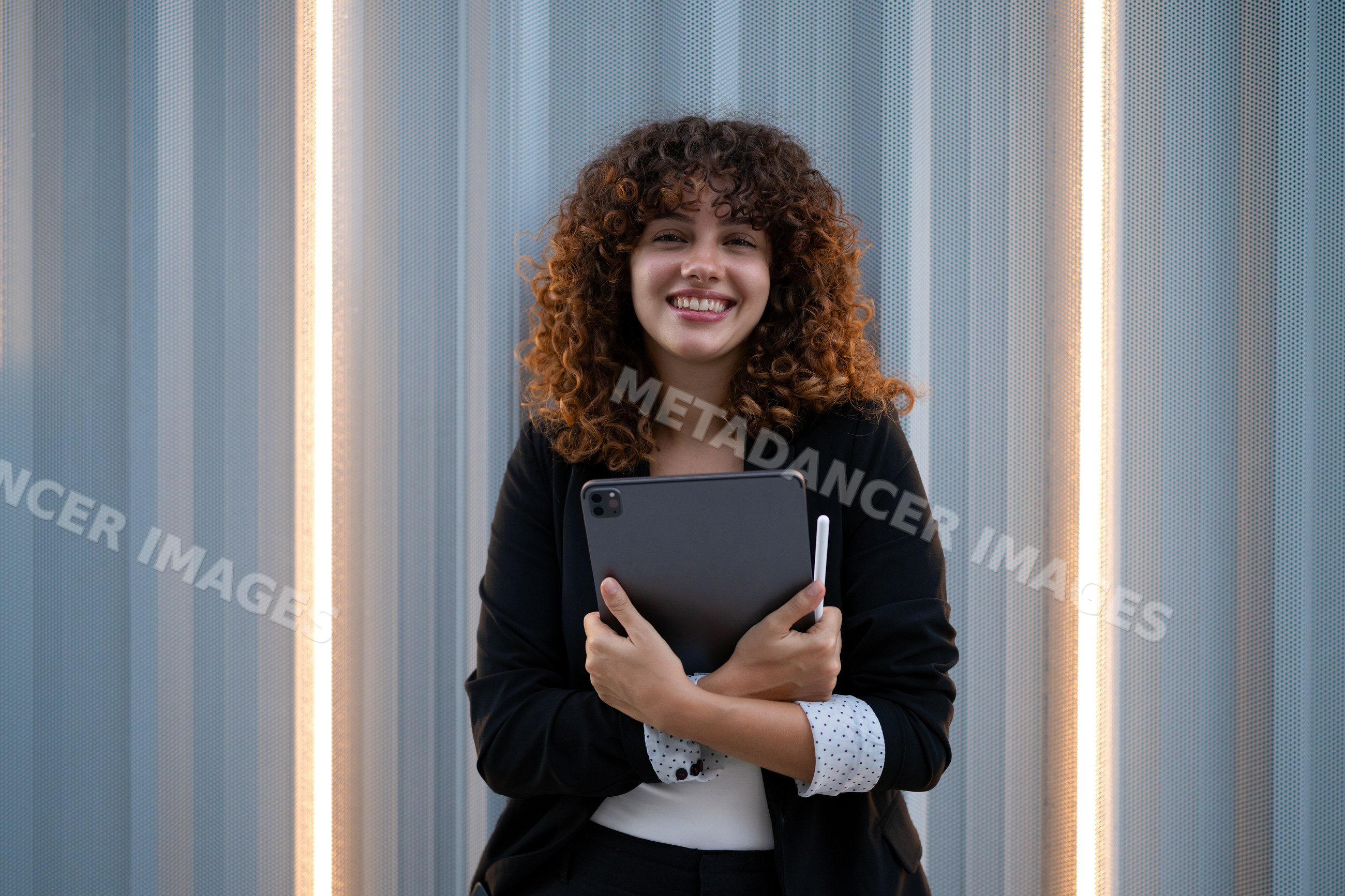Young businesswoman holding digital tablet