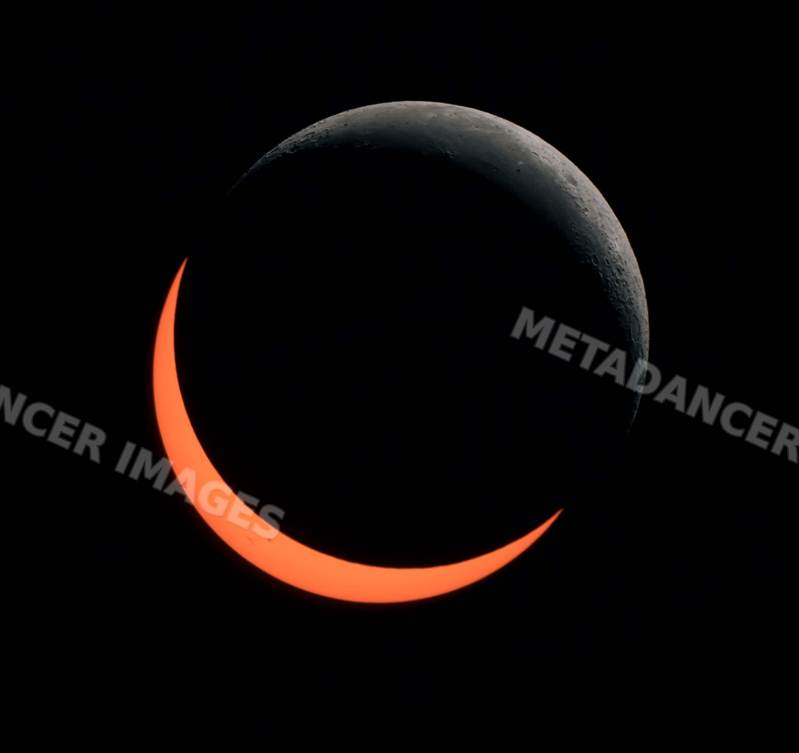 Partial solar eclipse with visible crescent moon and sun