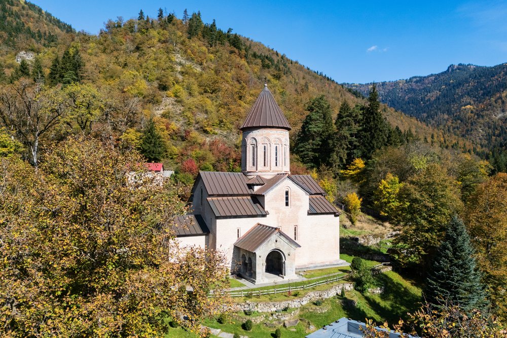 Tsagveri Timothesubvani Monastery surrounded by forested hills