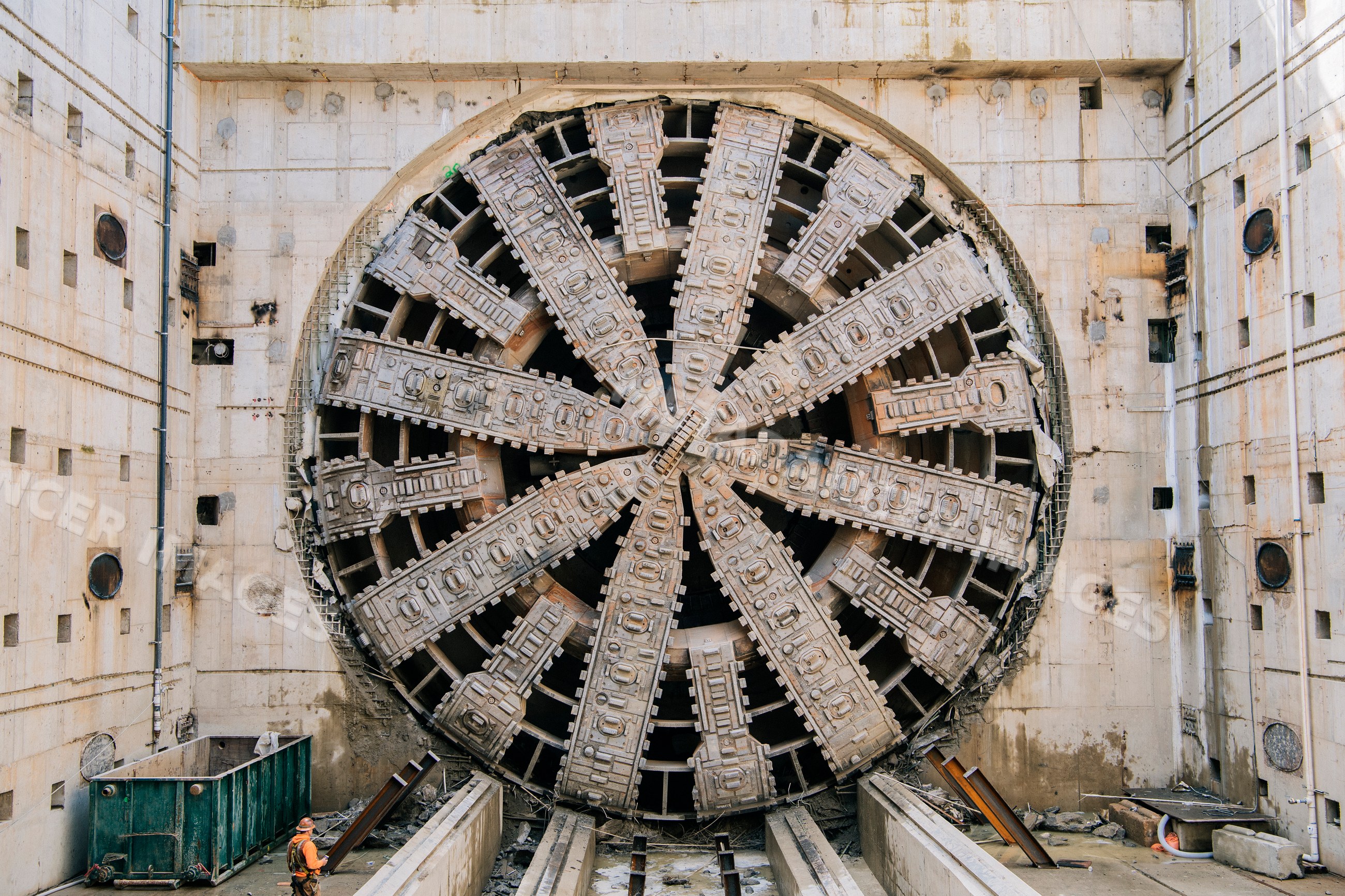 A tunnel boring machine operates at a construction site