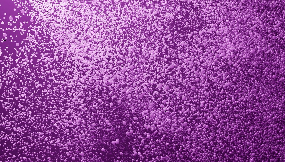 Purple particles floating densely in an abstract digital background