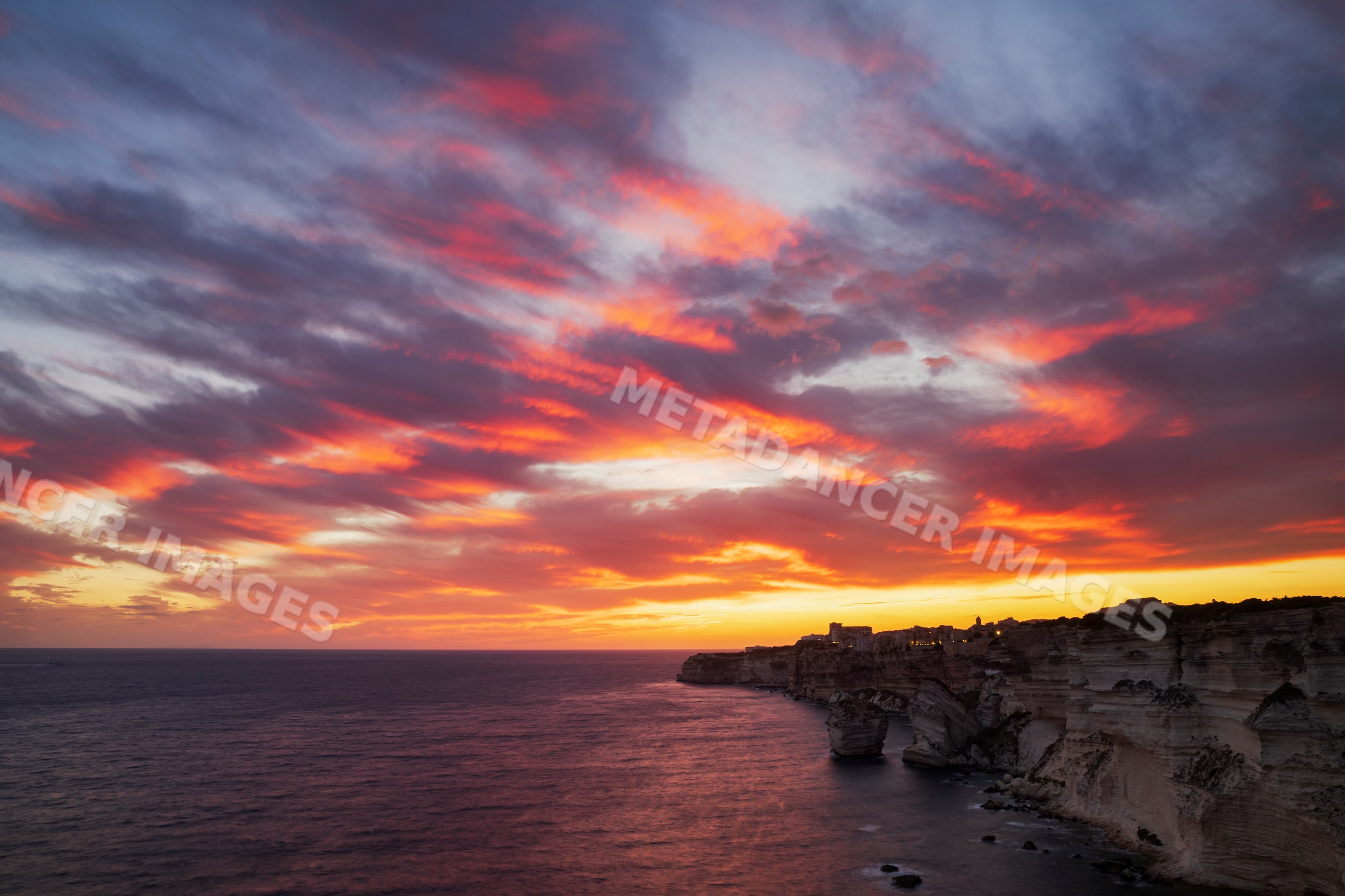 Sunset over cliffs and sea at Bonifacio, corsica, france
