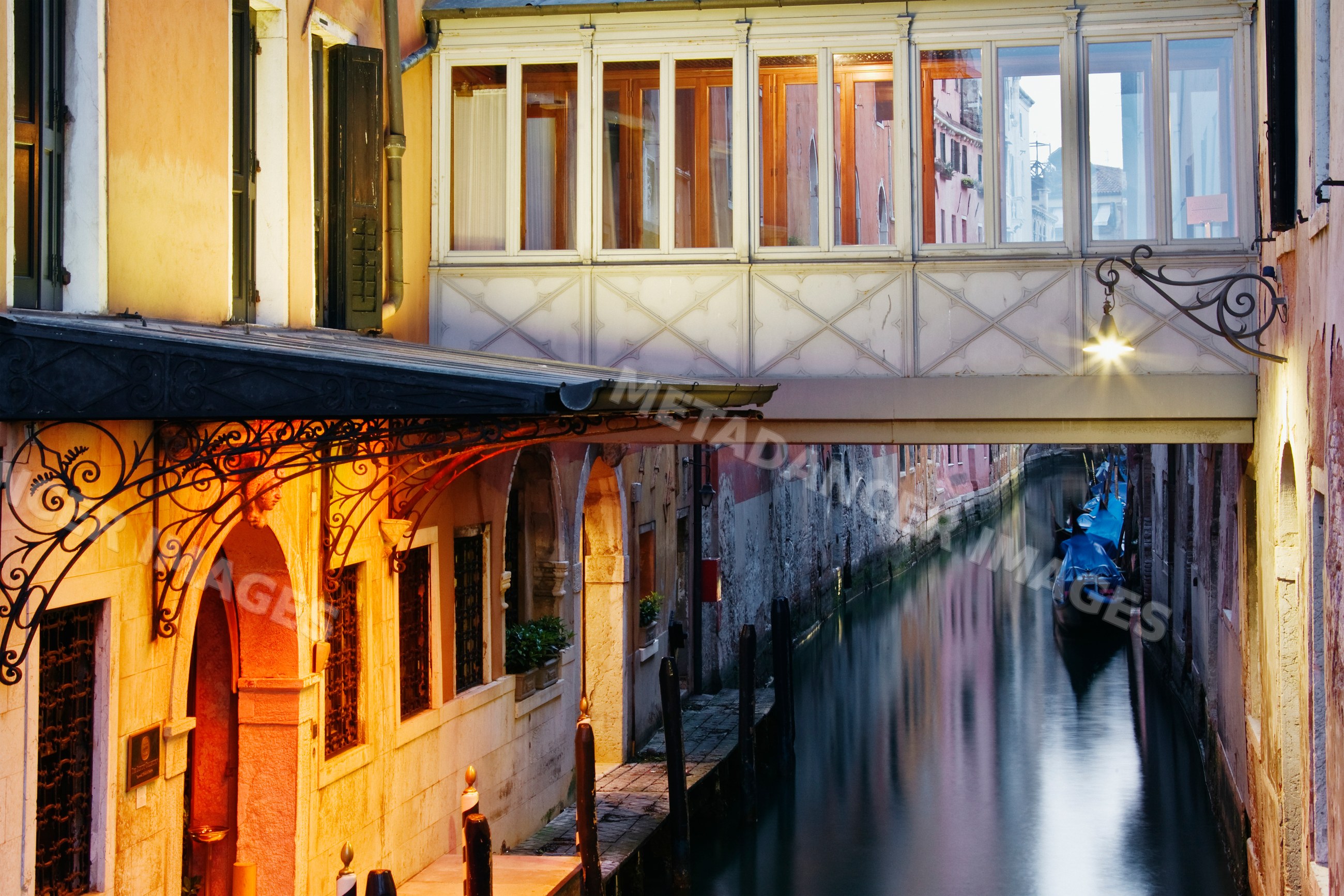 Veneto canal in venice italy with gondolas and historic buildings