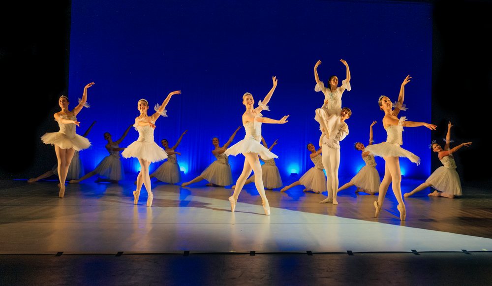 Ballet dancers perform a holiday-themed ballet on stage