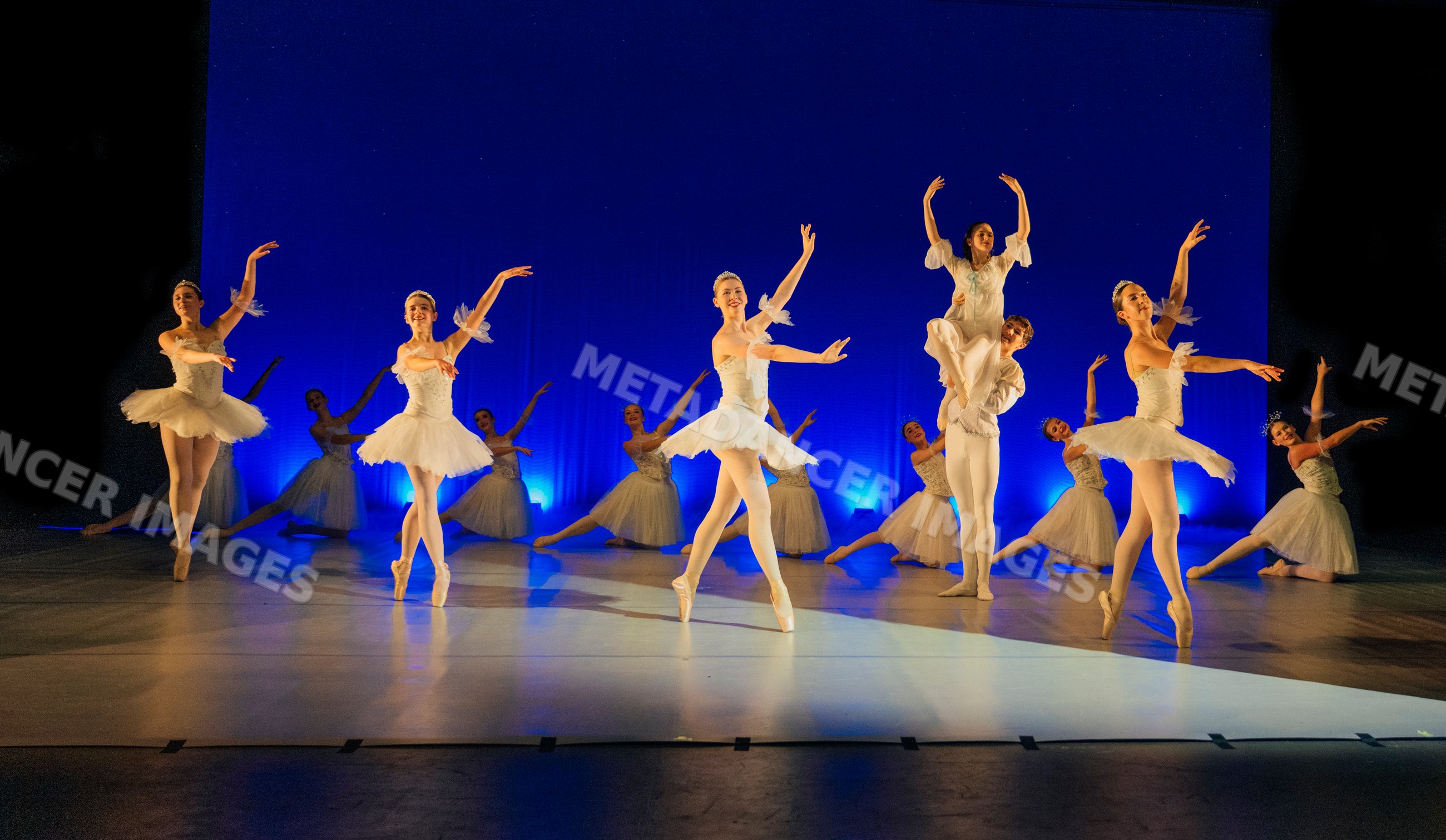 Ballet dancers perform a holiday-themed ballet on stage