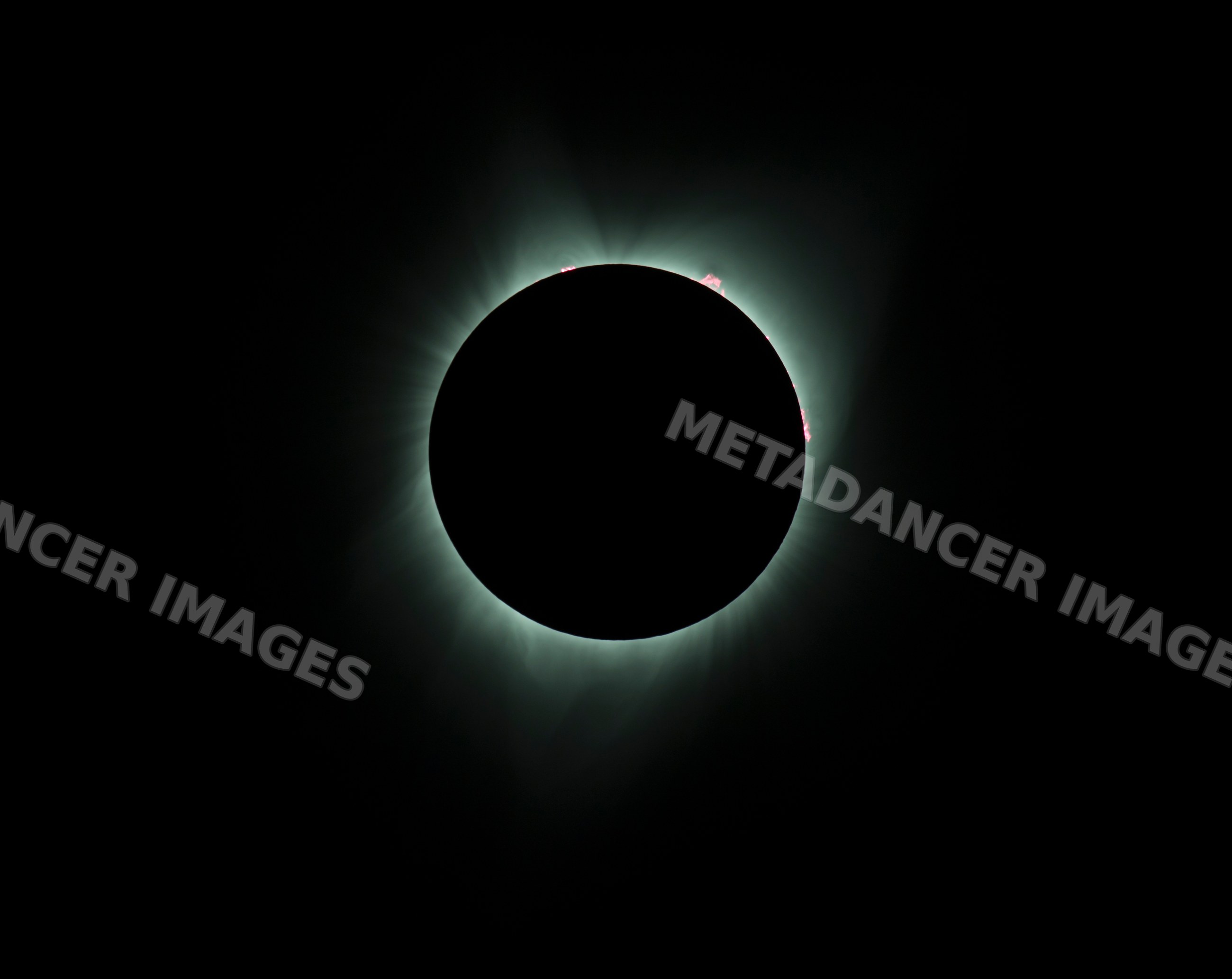 Solar eclipse displaying the sun's corona beyond the moon