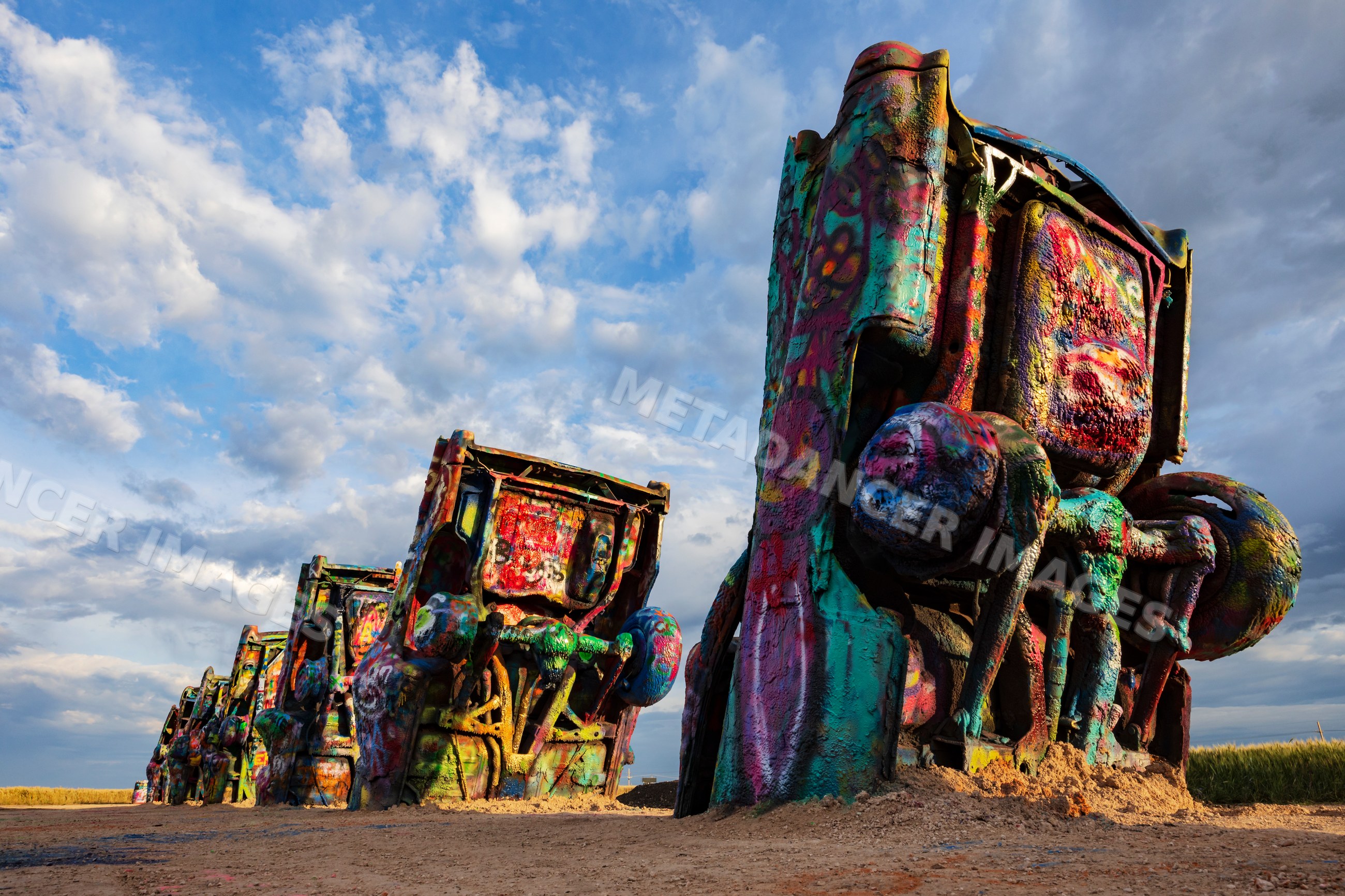 Cadillac ranch colorful car sculptures at Sunrise in amarillo texas