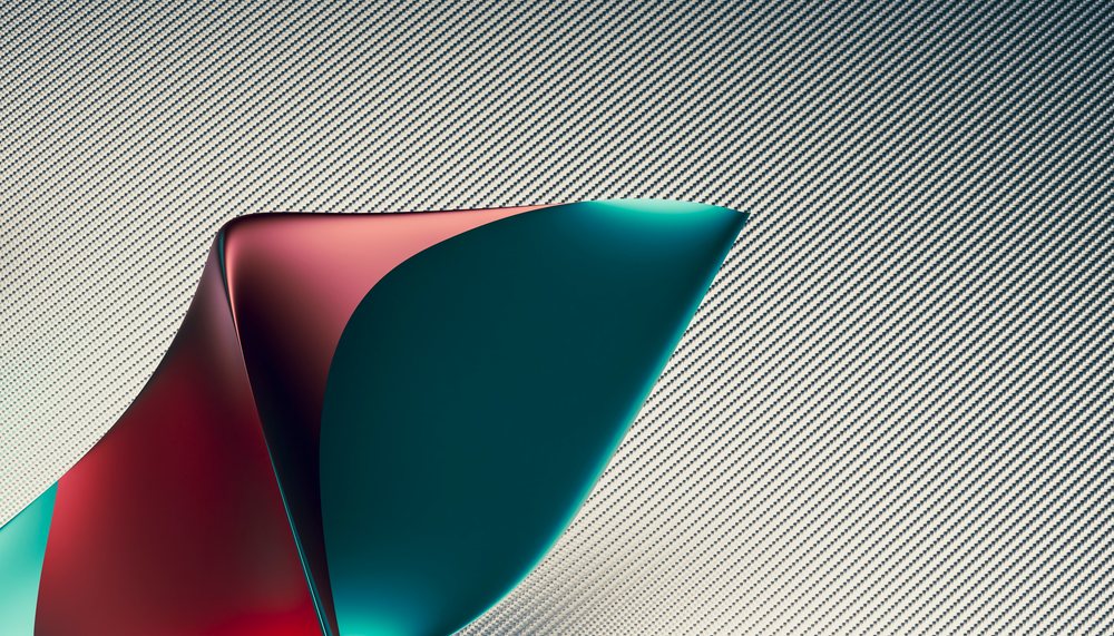 A colorful abstract metal sculpture with curved shapes and textured