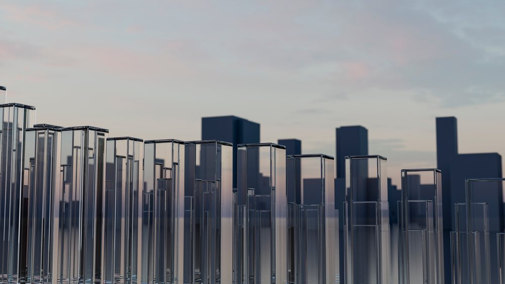 Glass towers and city skyline at sunset with modern skyscrapers