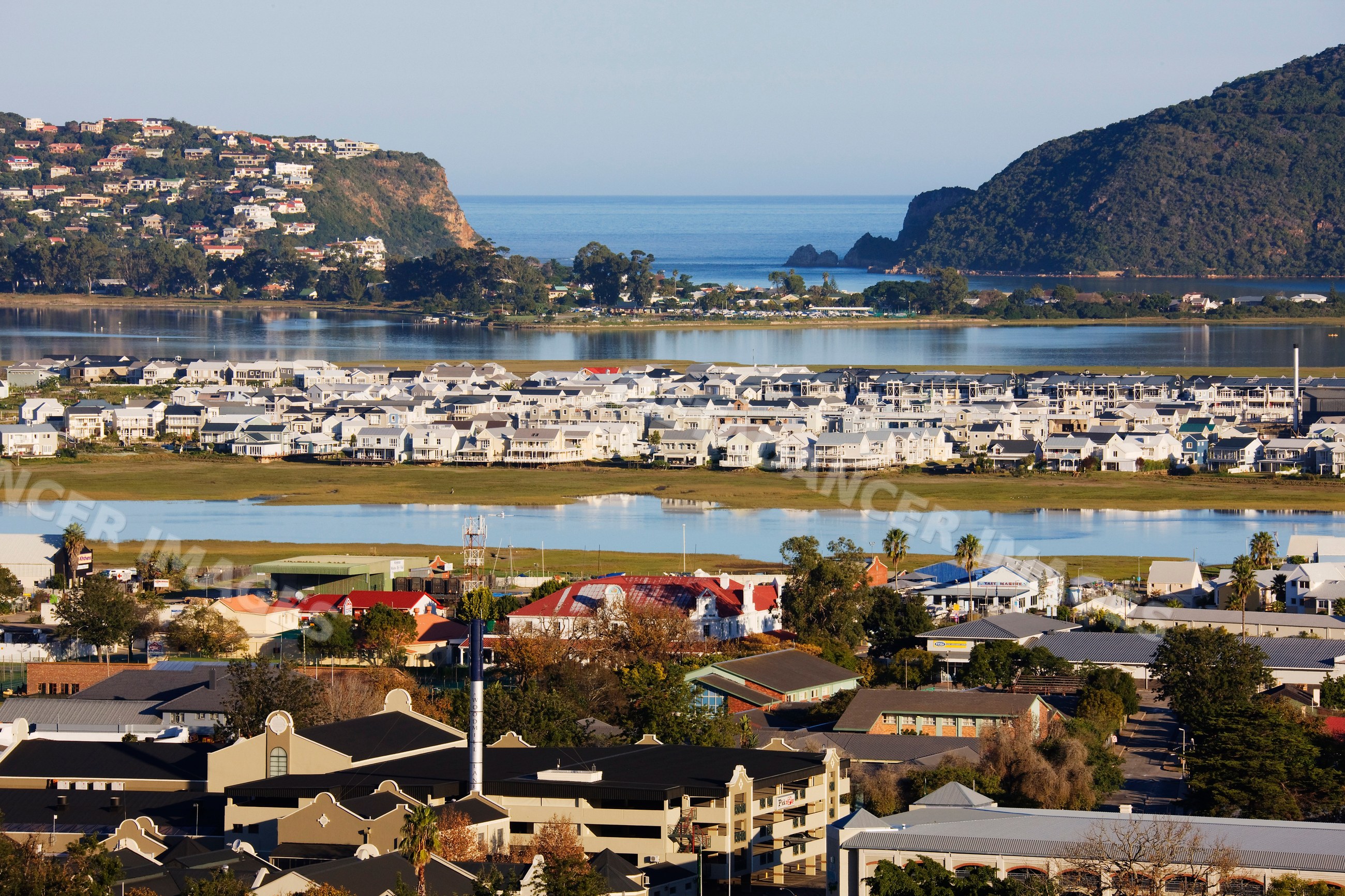 Knysna town by lagoon with houses and ocean south africa