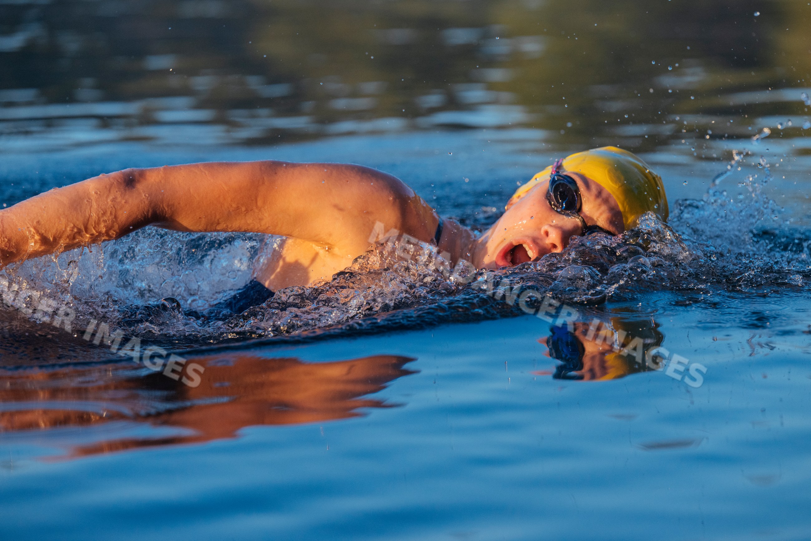 White swimmer doing freestyle stroke in open water