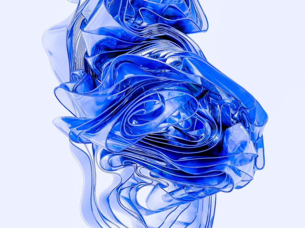 Close-up of an abstract blue transparent flowing ribbon sculpture