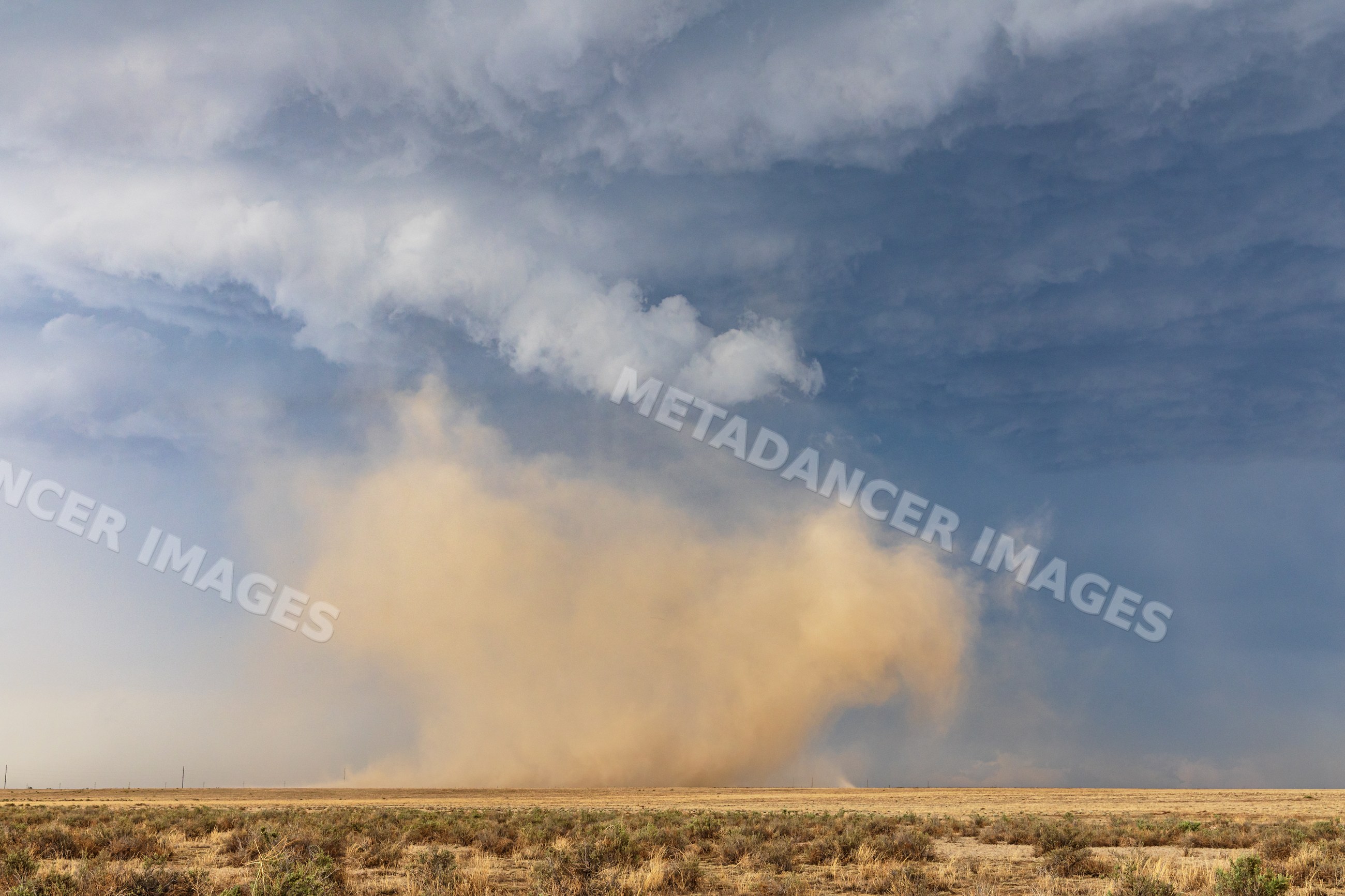 Land spout tornado kicking up dust near fowler, colorado