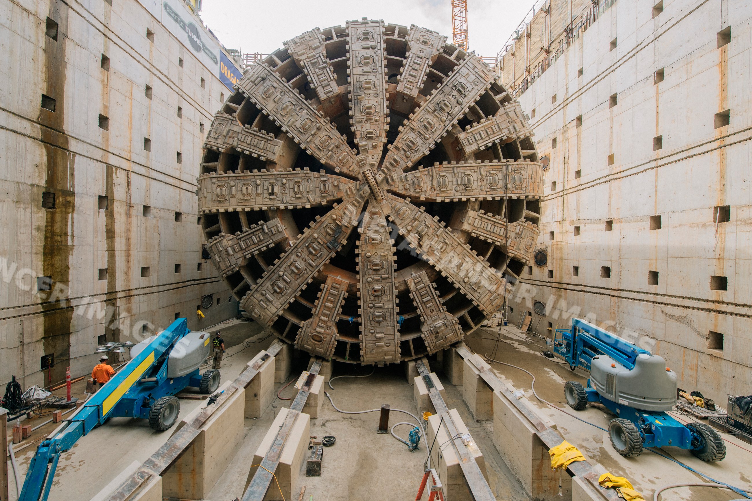 A tunnel boring machine at a concrete-lined construction site
