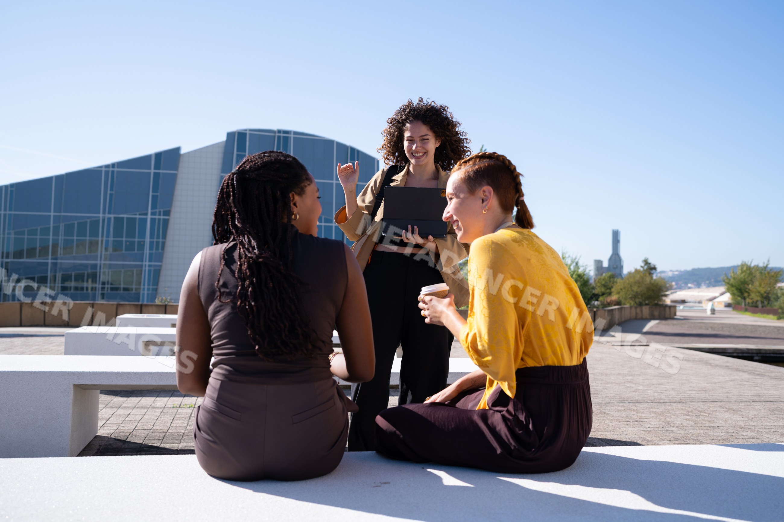 African American and white women conversing outdoors
