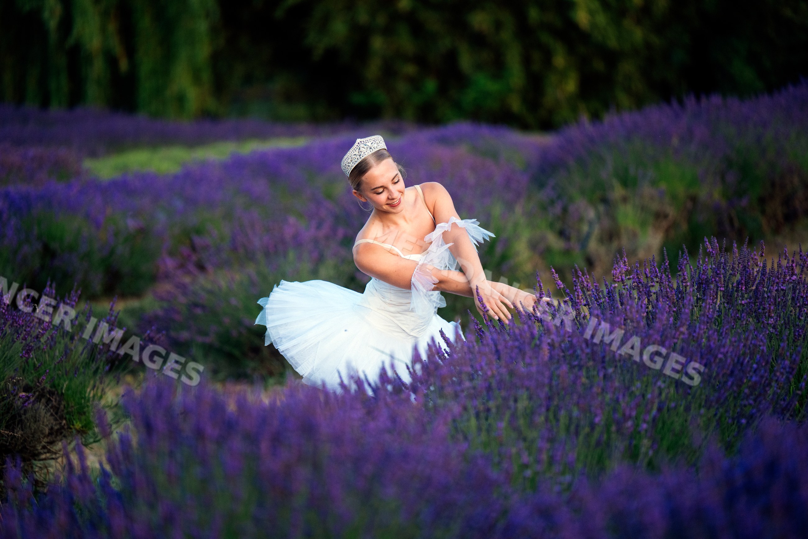 A ballet white dancer gracefully poses