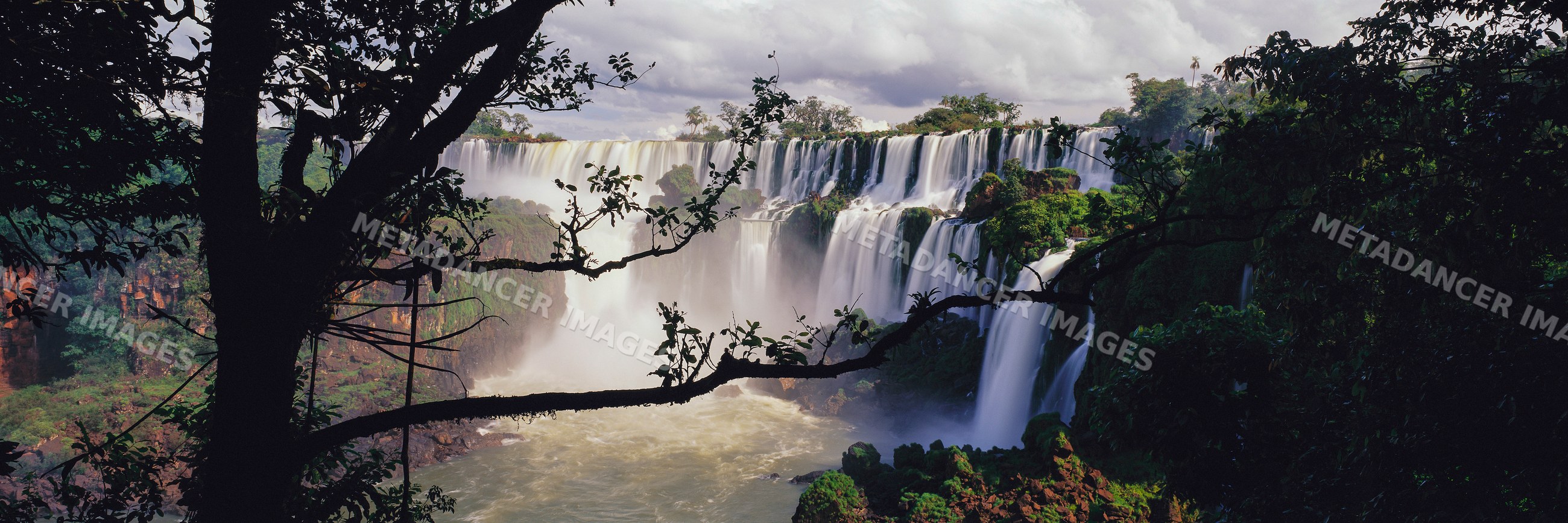 Iguacu falls cascading amid lush rainforest in misiones, argentina